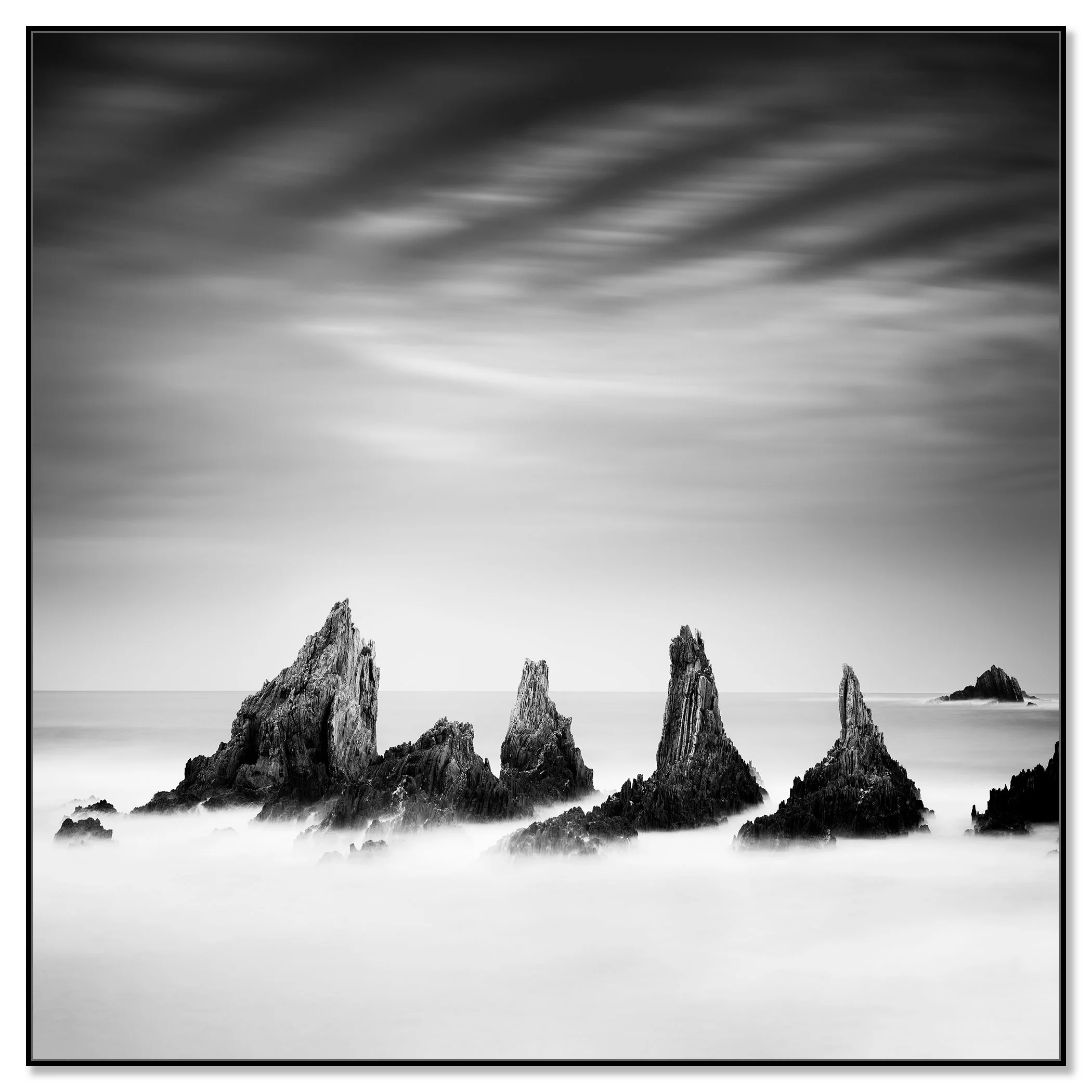 Rocky Peaks Study 4 – Spain black-and-white seascape print in a black aluminium ArtBox frame