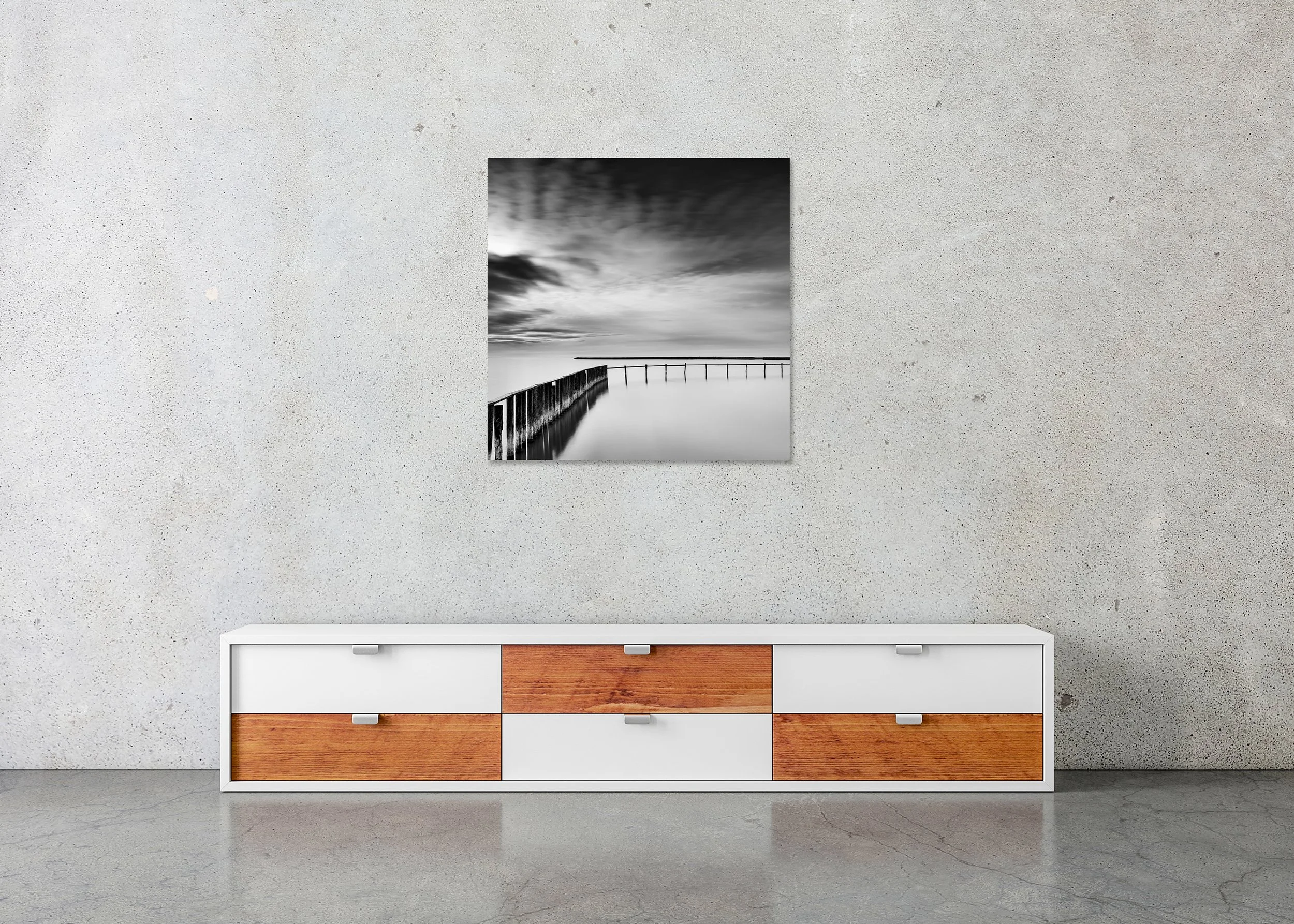 Swimming Area Study 3 displayed above a low cabinet as a frameless black-and-white aluminium Dibond print by Gerald Berghammer.