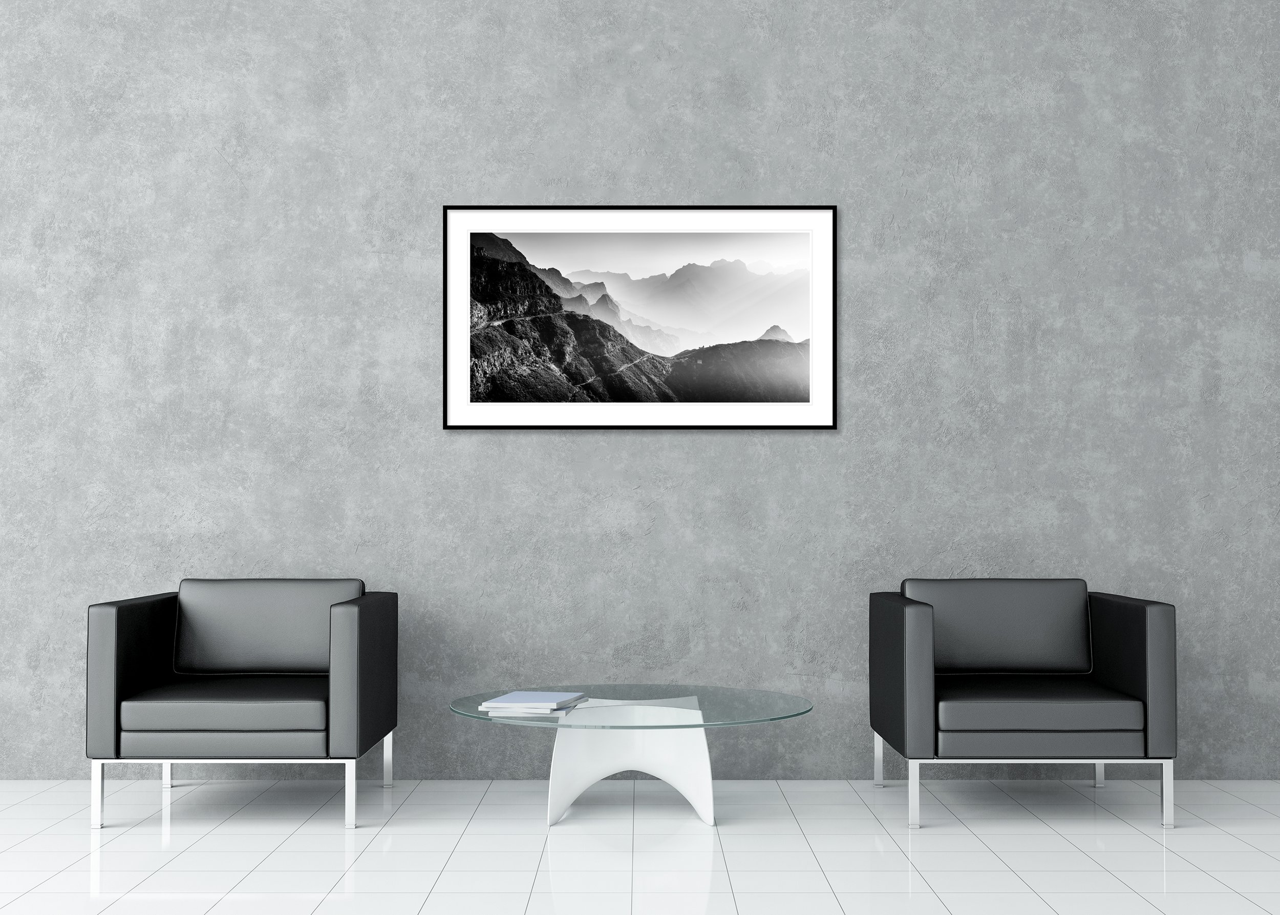 Gerald Berghammer black and white panoramic mountain photograph, framed with passepartout, featuring a winding road through dramatic alpine cliffs and misty layered mountains.