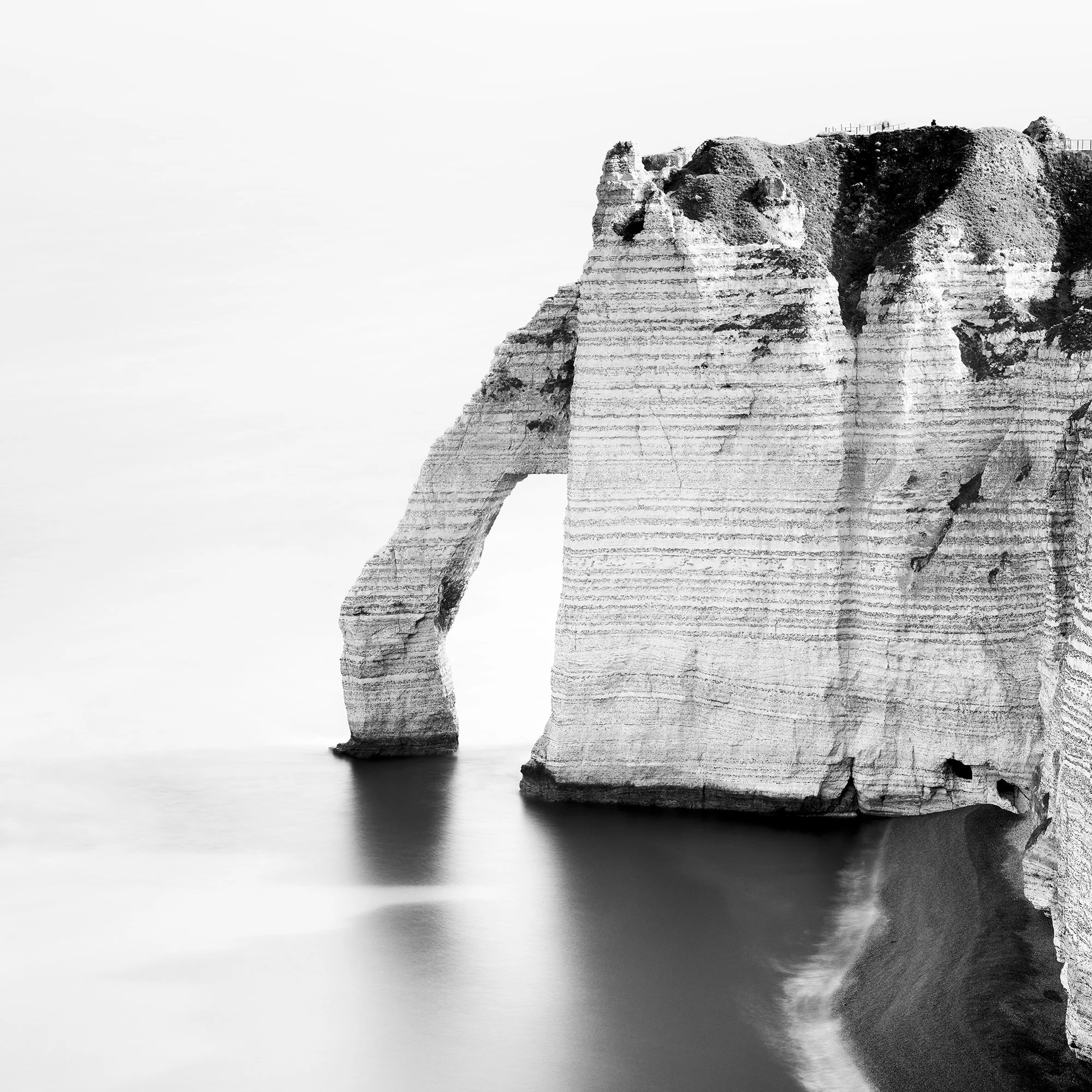 Detail of The Sea Arch at Étretat, France, showing chalk cliffs and sea arch. Photo by Gerald Berghammer.
