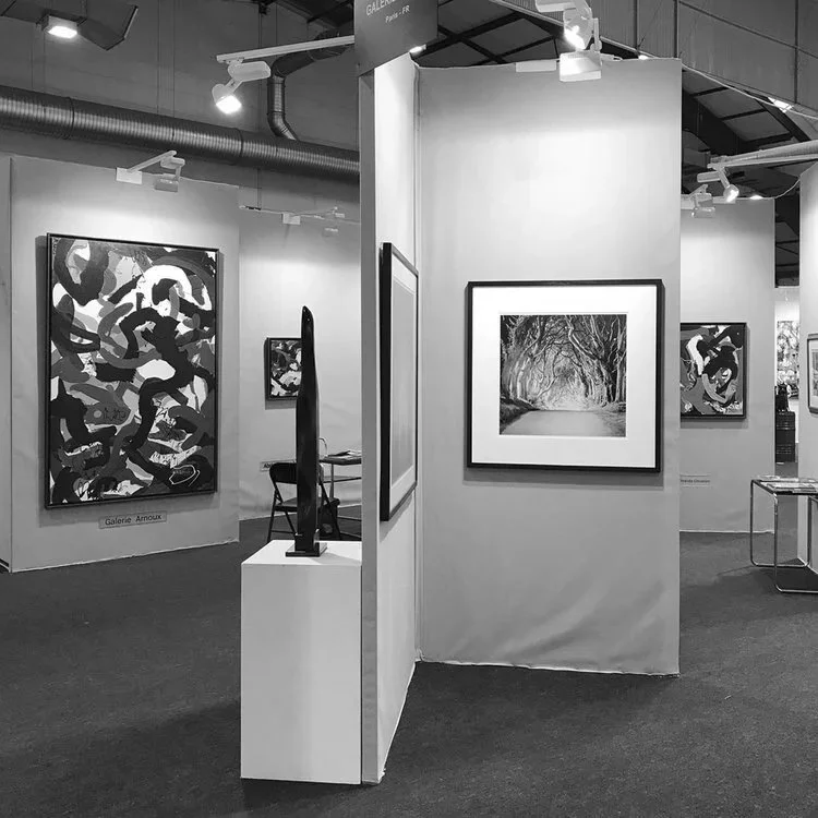 Black-and-white fine art photograph of a tree-lined avenue by Gerald Berghammer, exhibited at the Galerie Arnoux stand at ST-ART Strasbourg 2017.