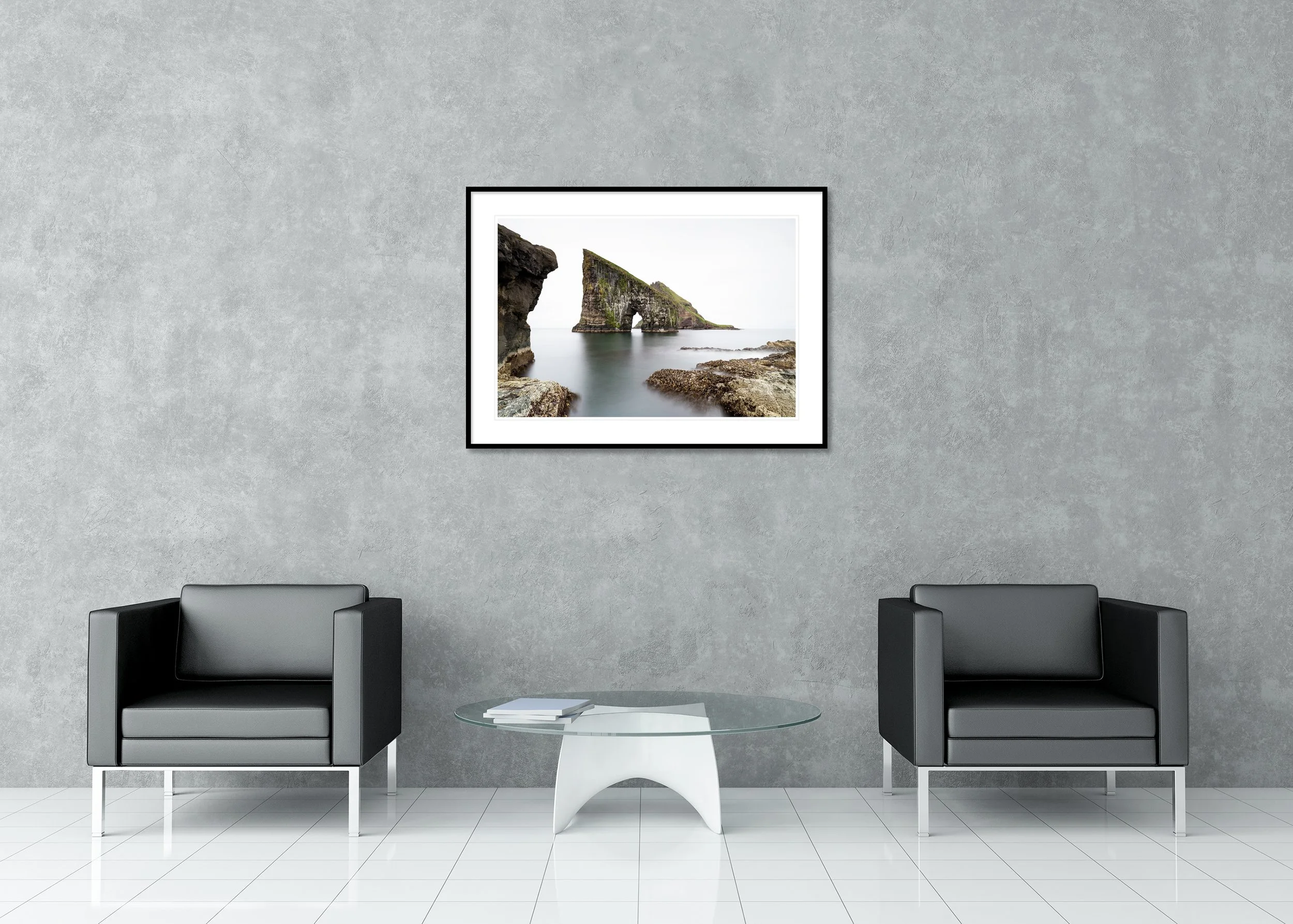 Drangarnir Sea Arch, Study 1 – archival pigment print in a black aluminium frame with a white mount displayed in a modern lounge.
