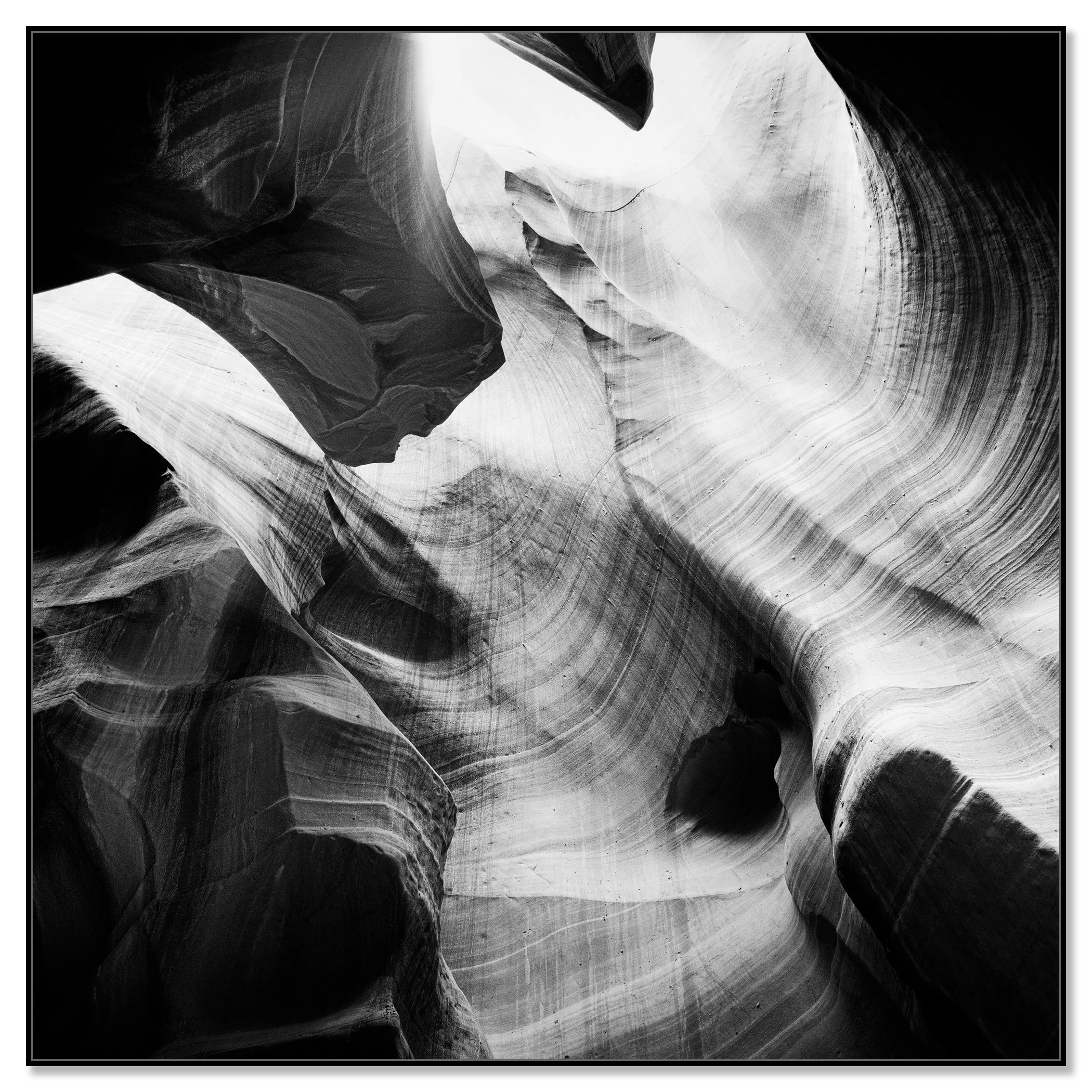 Antelope Canyon Study 8 displayed as a black-and-white Dibond print in a black aluminium ArtBox frame by Gerald Berghammer.