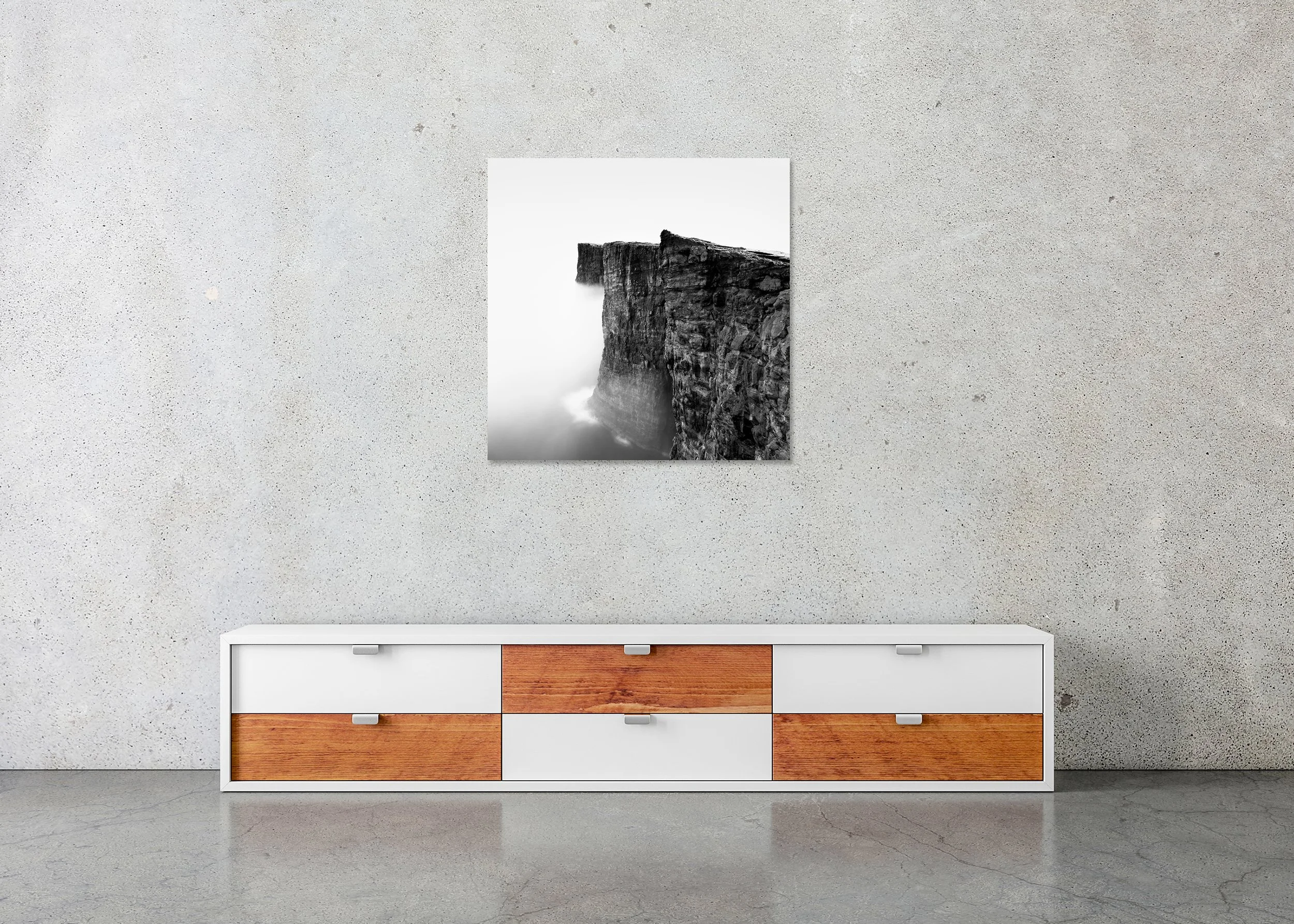 SEO-safe image alt text (UK)  Black-and-white photo of steep coastal cliffs above the ocean, rugged rock textures fading into sea mist, on a frameless ChromaLuxe metal print.