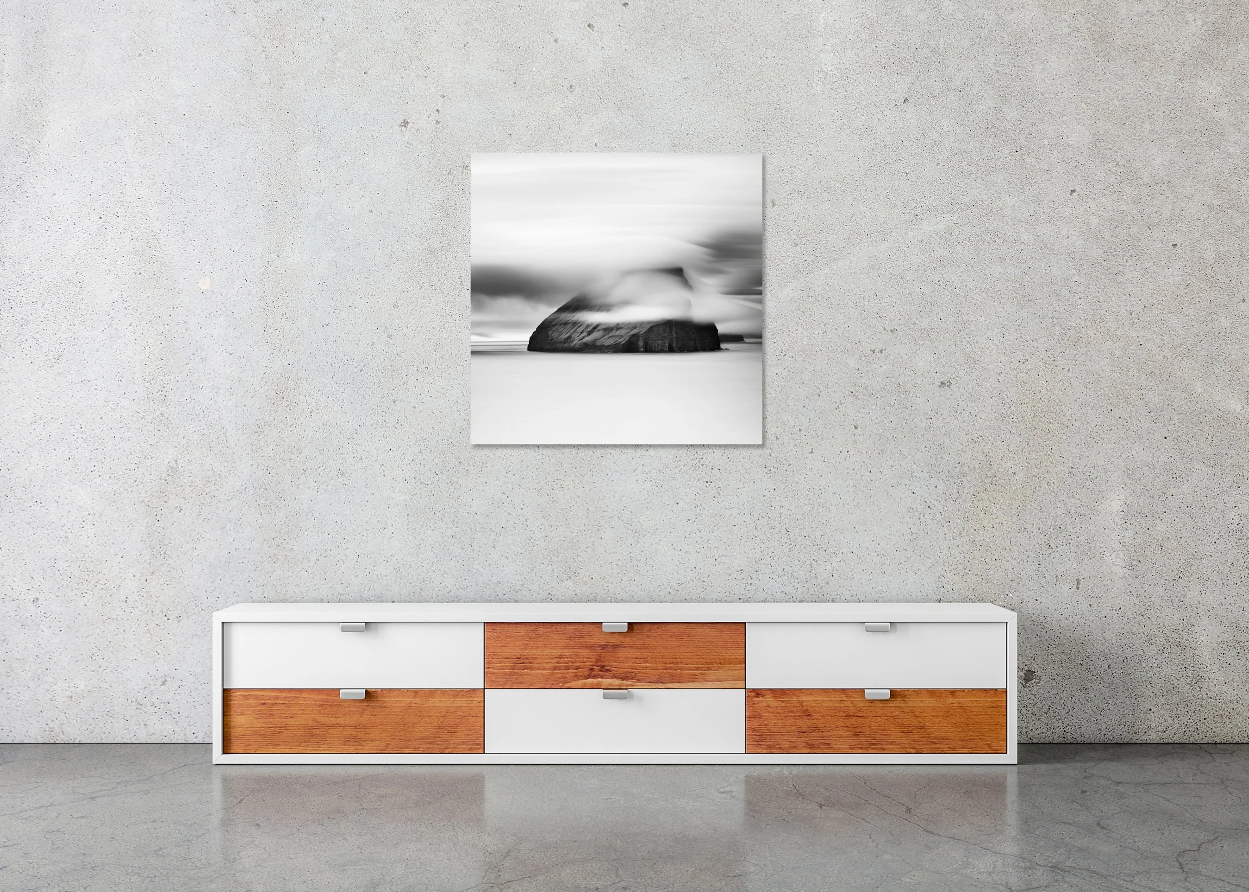 Fine art black and white landscape print of a dramatic sea rock island beneath flowing cloud, photo print mounted to Dibond, frameless