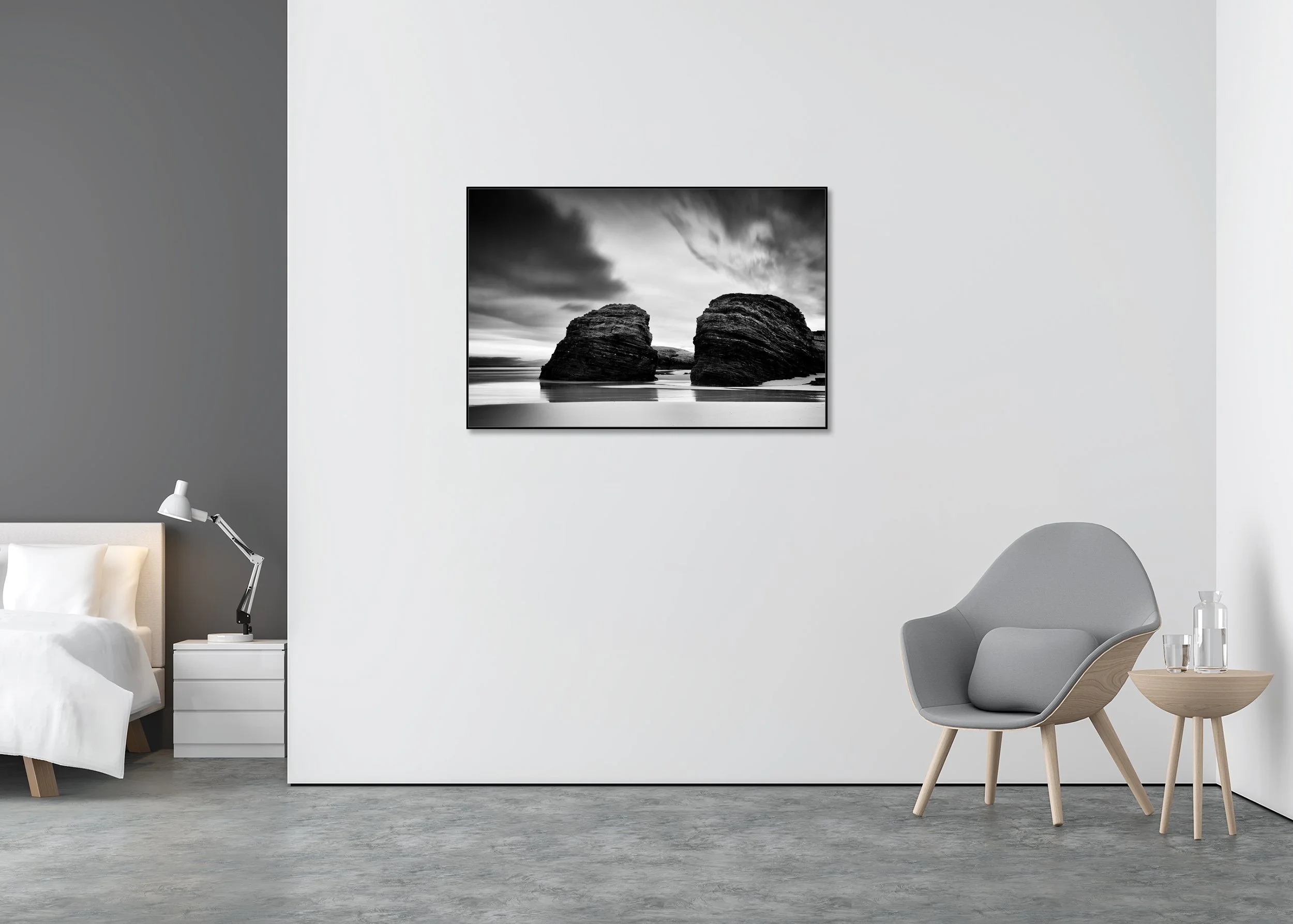 Minimalist black and white coastal landscape photo print of two rounded rocks on the shoreline beneath a cloudy sky, mounted on Dibond in an aluminium ArtBox.
