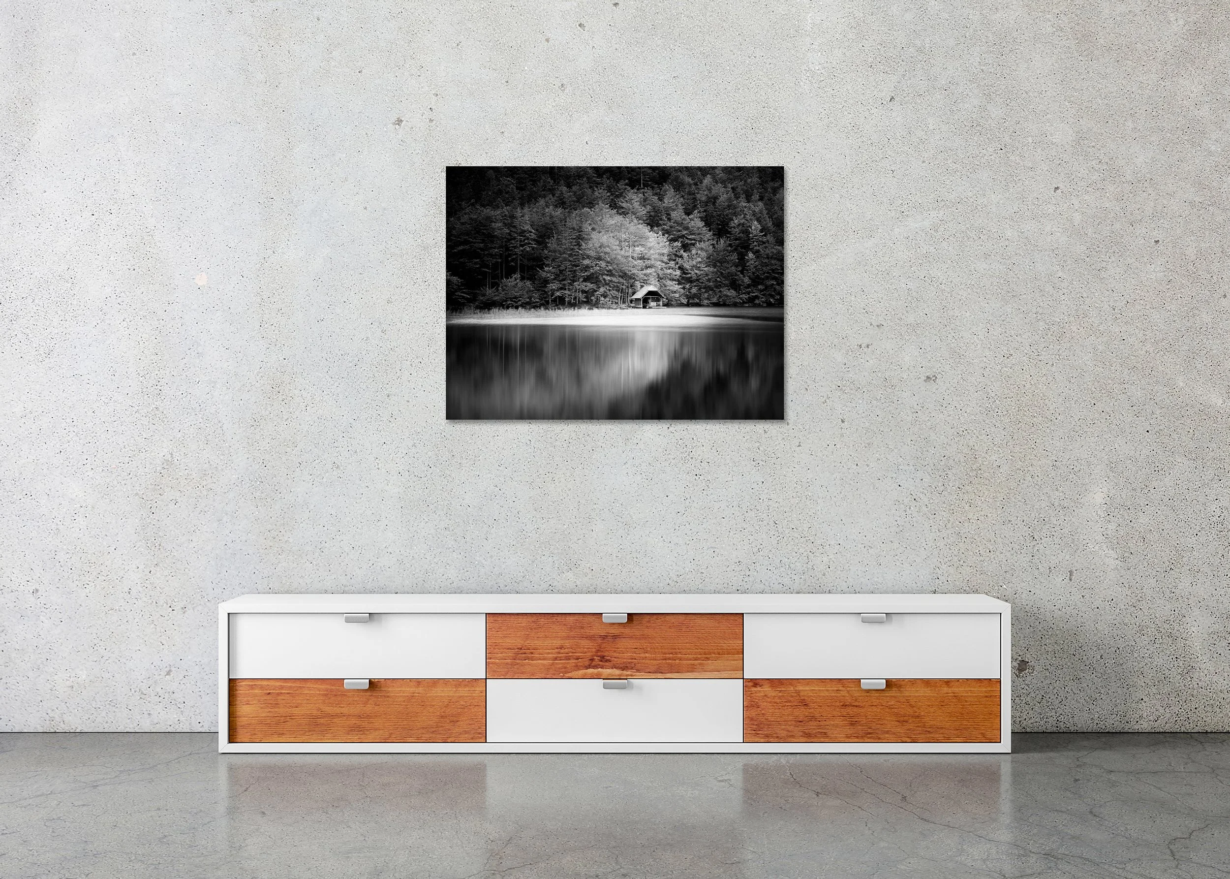 Wooden Boathouse, Study 1 – frameless black-and-white photograph on aluminium Dibond displayed above a low cabinet.