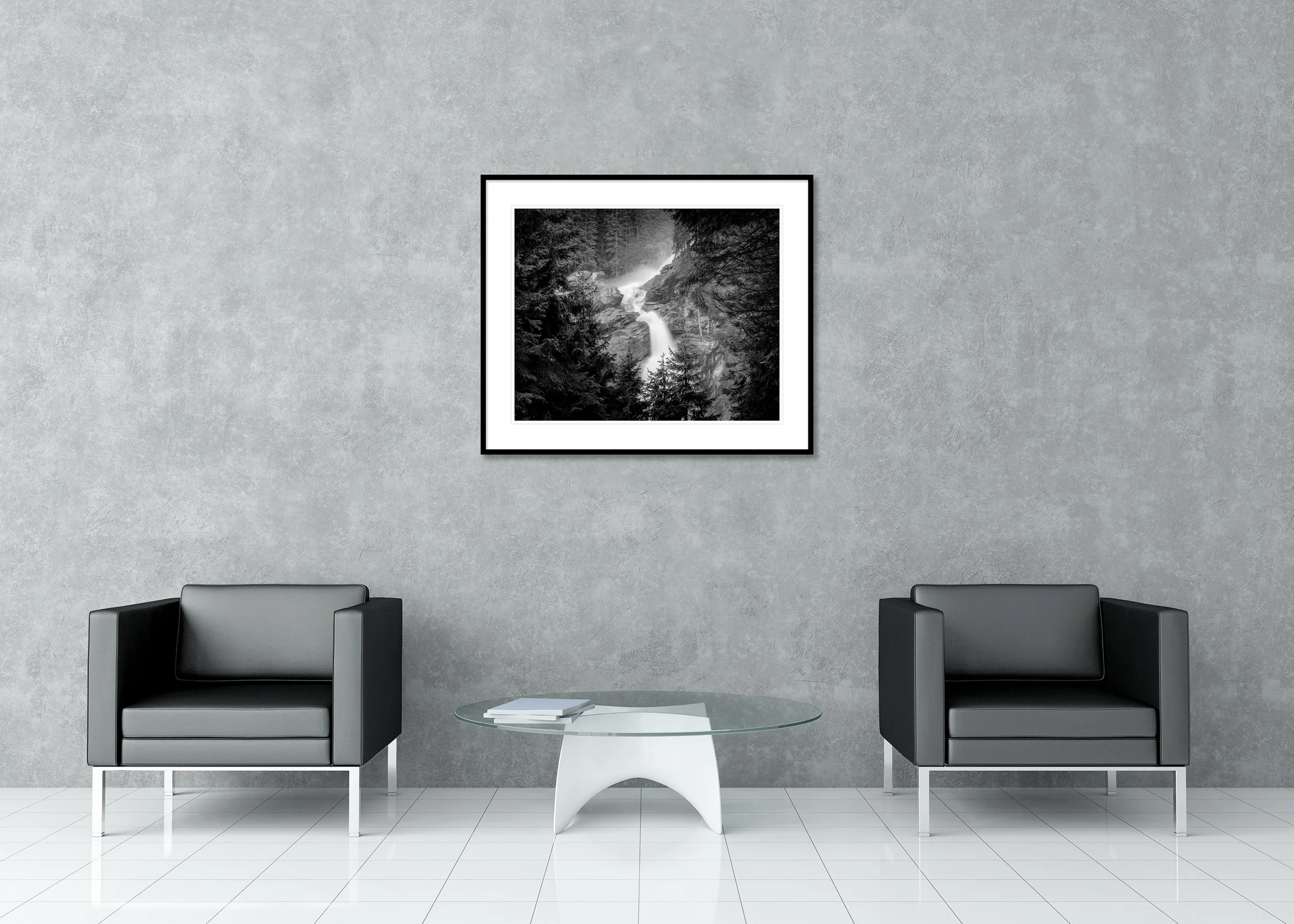 Moody monochrome archival pigment print of Krimml Waterfalls in a forested mountain setting, presented in a classic frame with a mount