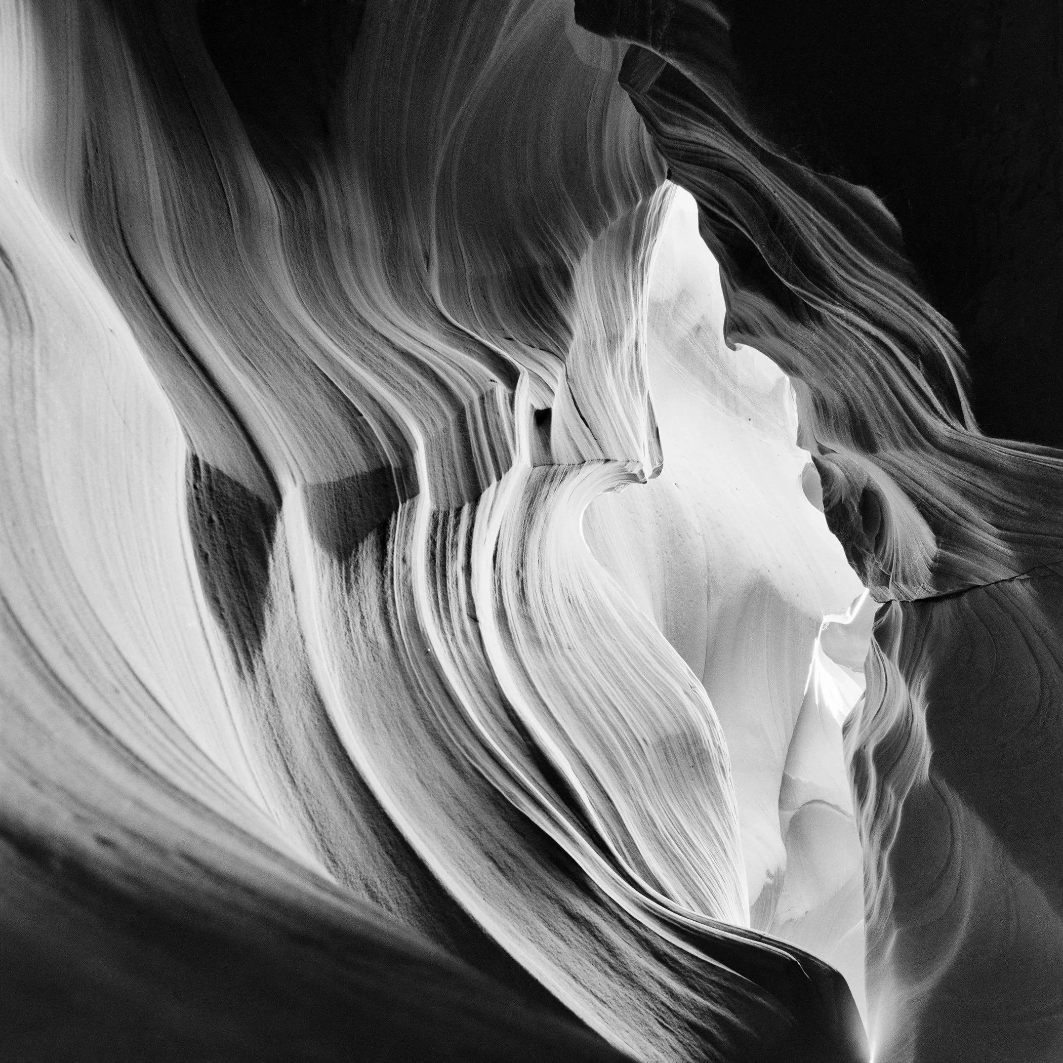 Black-and-white photograph of Antelope Canyon Study 3, with sculpted slot-canyon curves and dramatic natural light.
