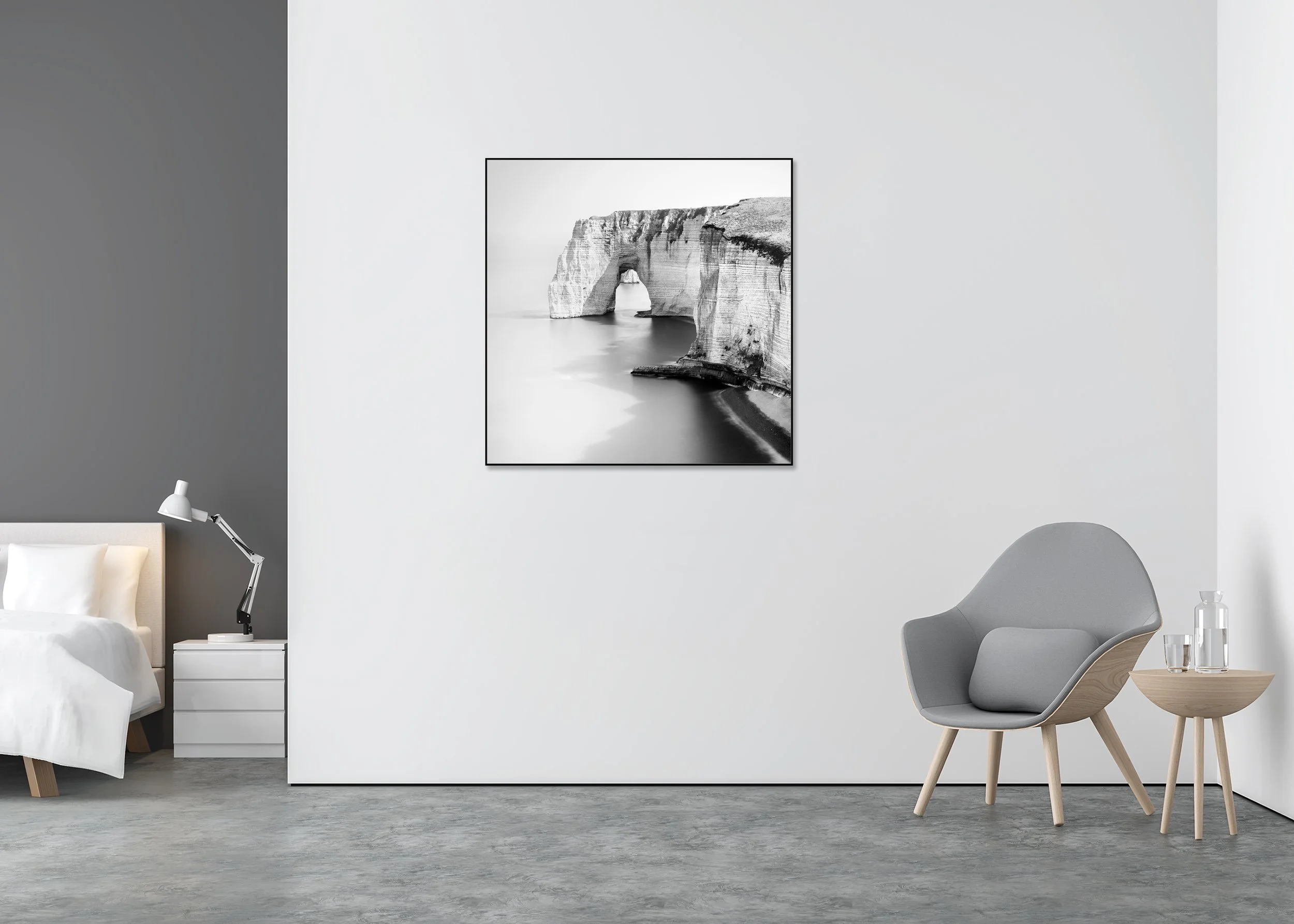 Alt text (UK, Google-safe): ChromaLuxe metal print in an aluminium ArtBox frame showing a black and white photo of a rugged coastline with a natural rock arch above the water.