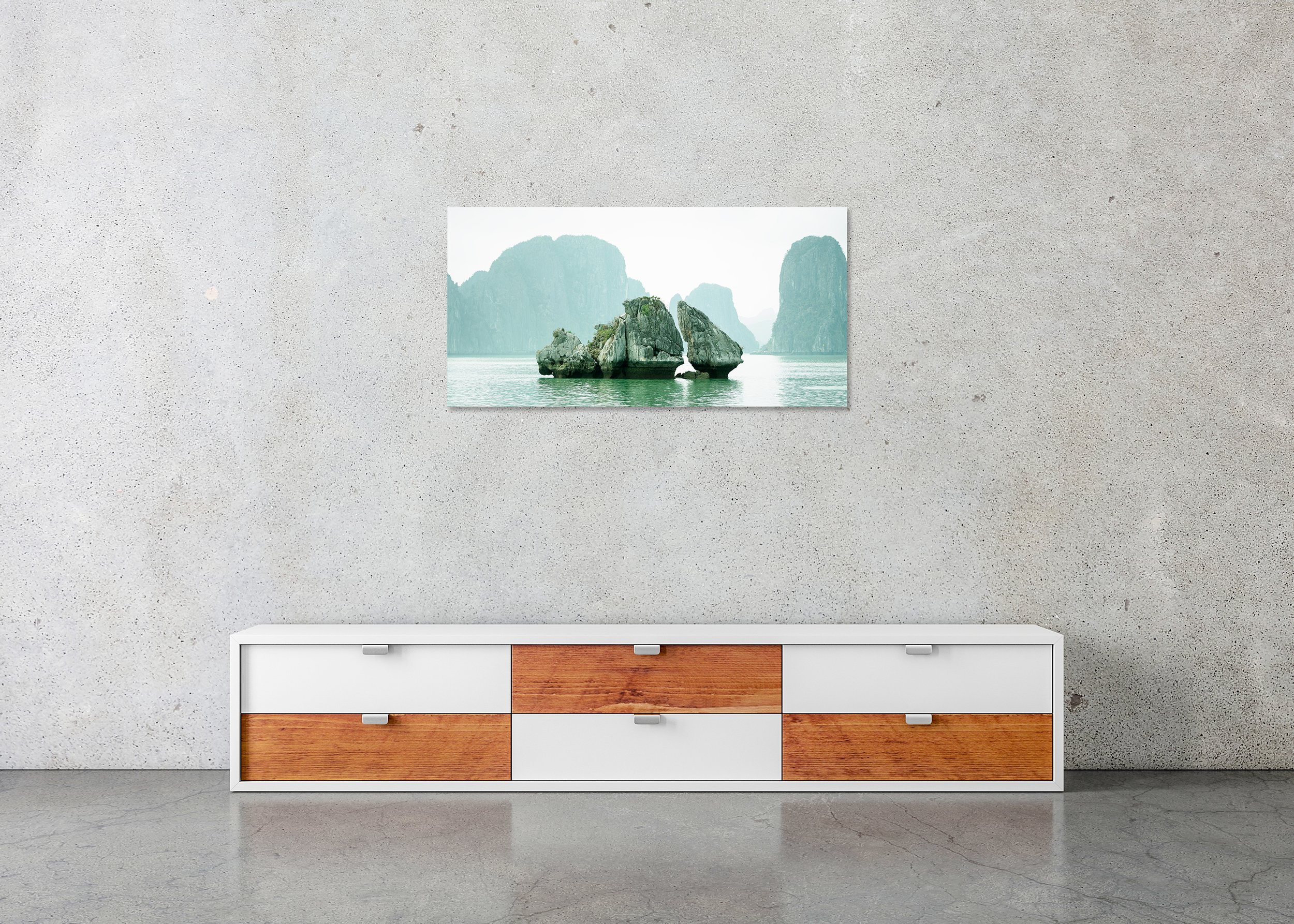 Rock Shapes Panorama – Ha Long Bay, frameless colour photograph on aluminium Dibond displayed in a minimalist interior. Photo by Gerald Berghammer.