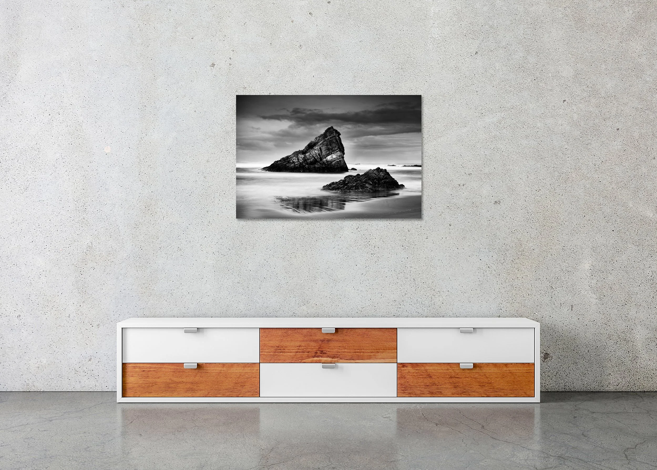 Frameless ChromaLuxe metal print featuring a black-and-white Bay of Biscay seascape with jagged rocks, smooth water and dramatic clouds, Spain.
