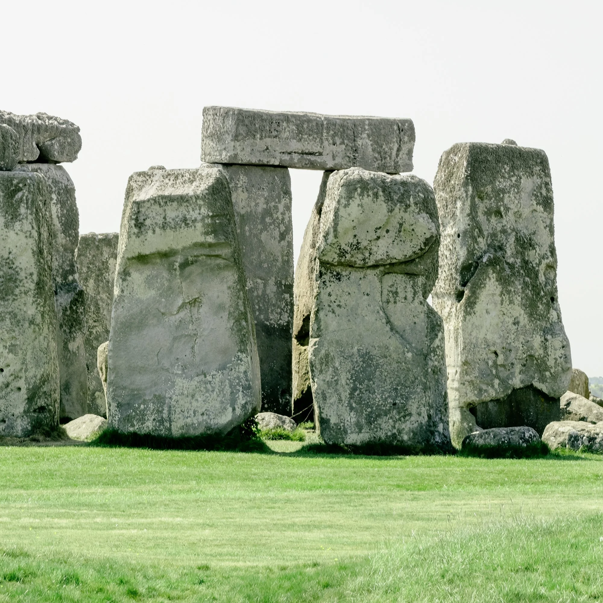 Gerald Berghammer - Color landscape panorama photography. Historic Stonehenge monument with large standing stones on a grassy field under a gray sky. Print detail 3