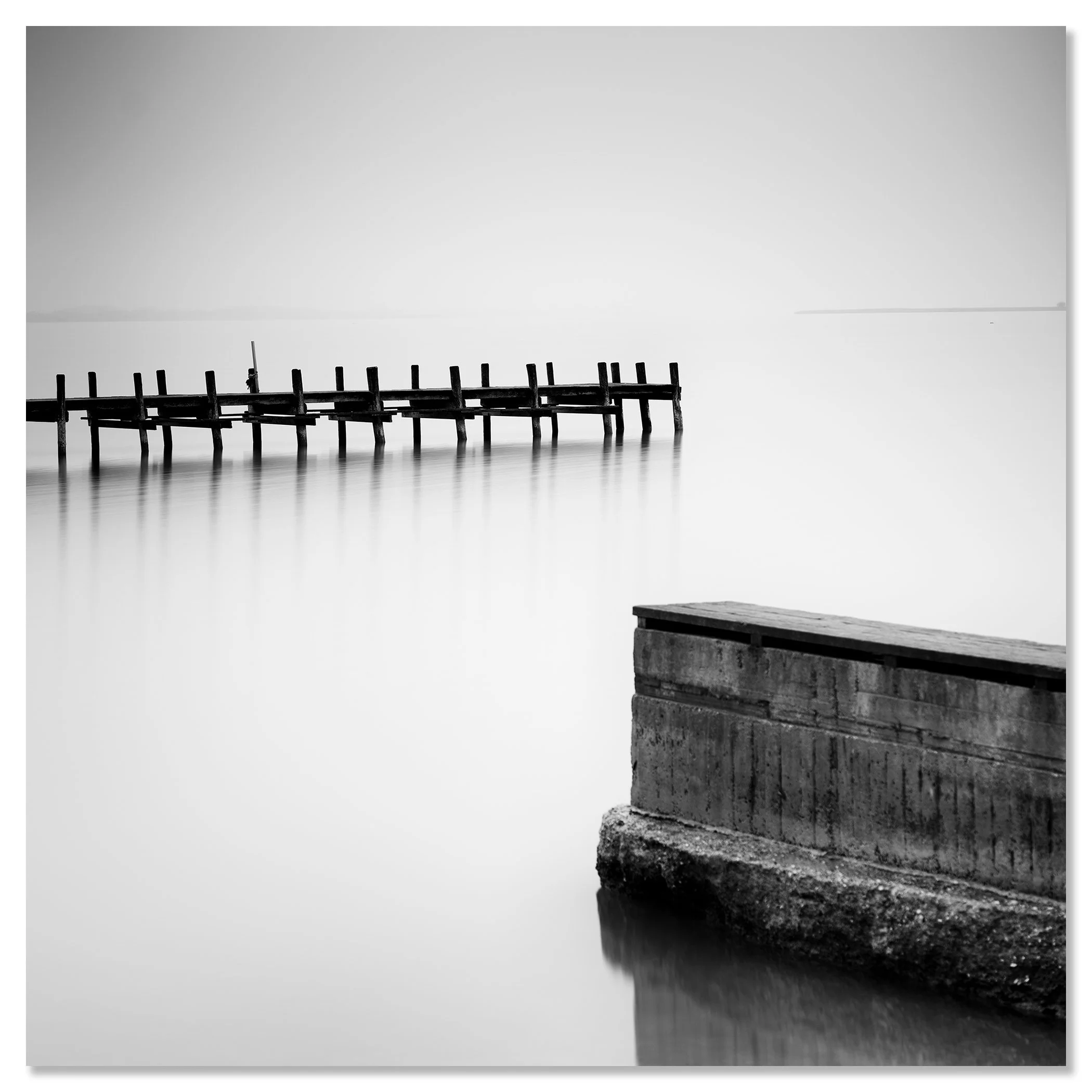 Minimalist black and white image of still water with a deserted wooden dock – dibond frameless
