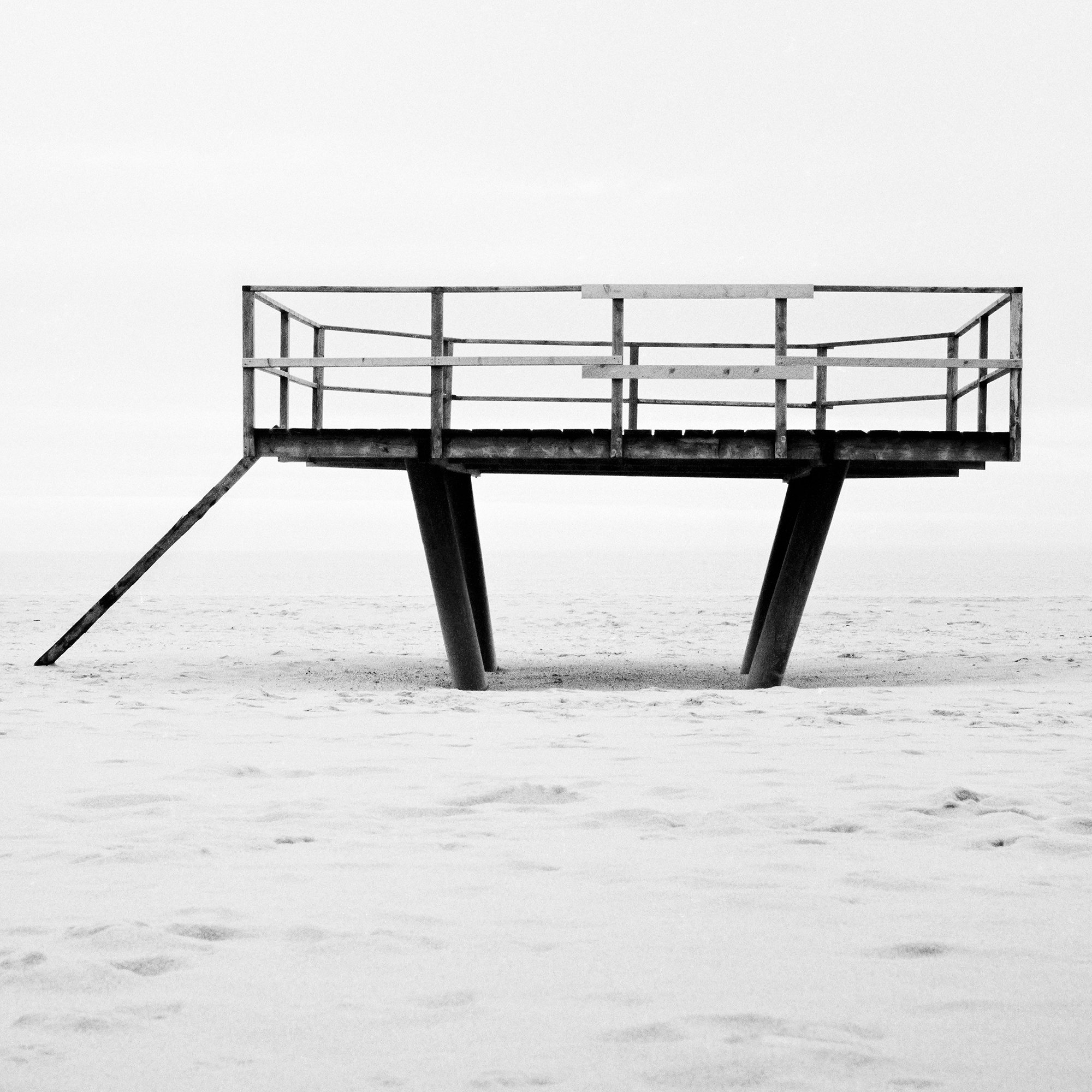 Dance Floor – close-up of the elevated platform on the sandy beach of Sylt, Germany, by Gerald Berghammer.