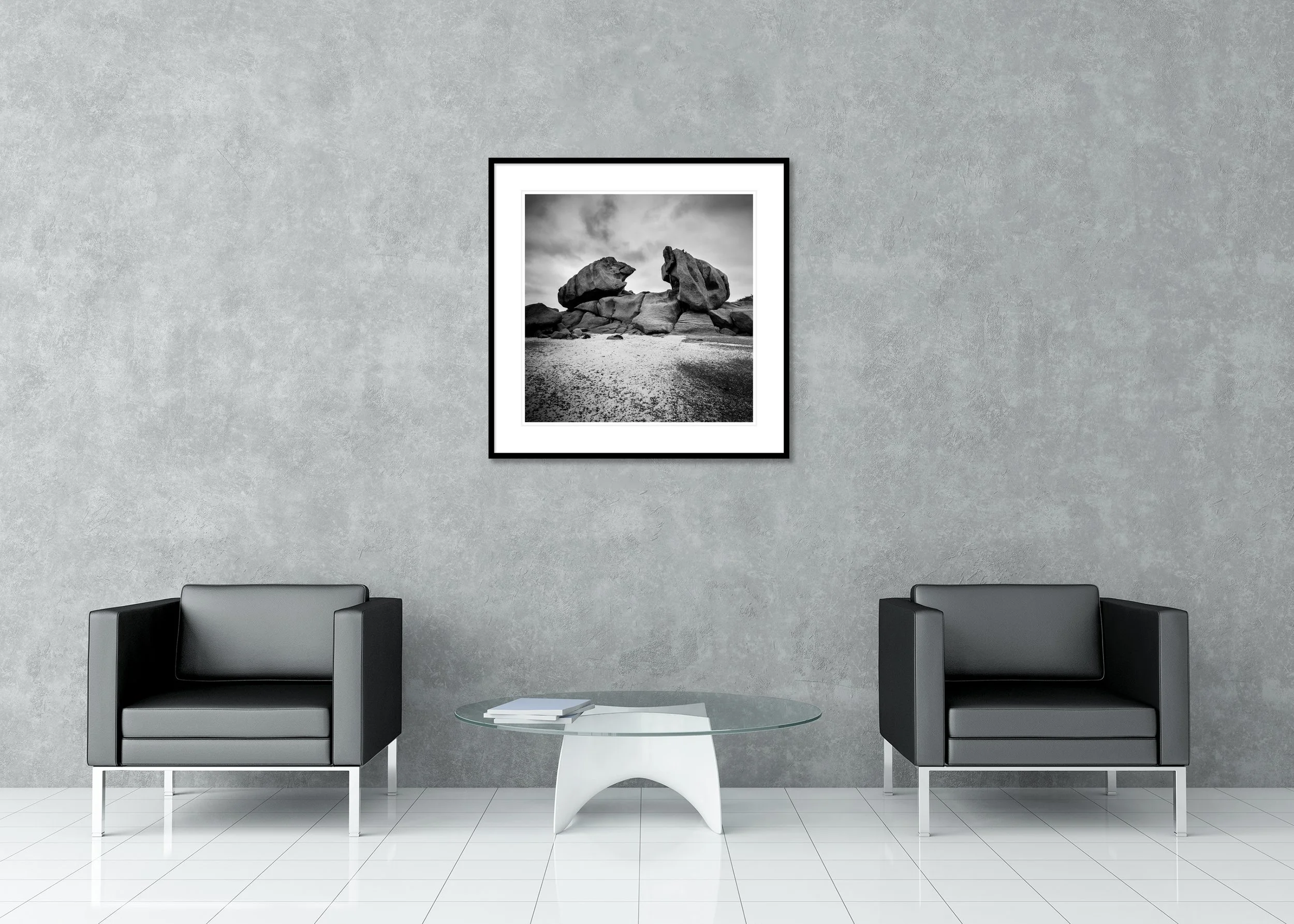 Monochrome coastal landscape with giant granite rocks and sandy beach on a rugged granite coast, archival pigment print in a classic framed mount