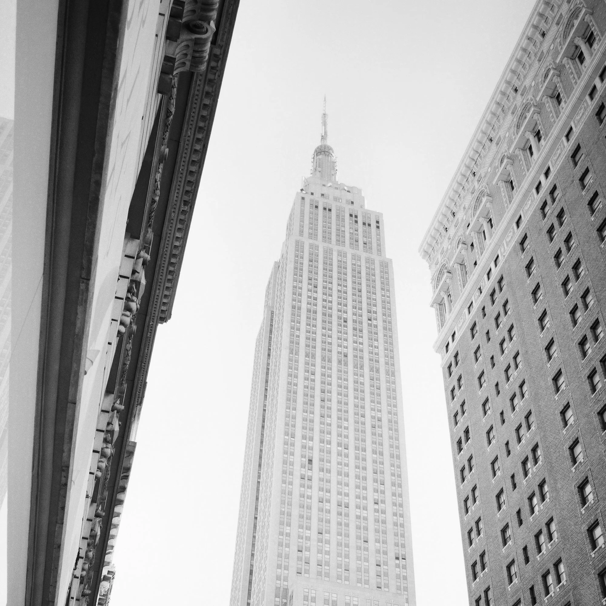 Close-up of the Empire State Building framed by Manhattan architecture in Victoria’s Secret Store by Gerald Berghammer.