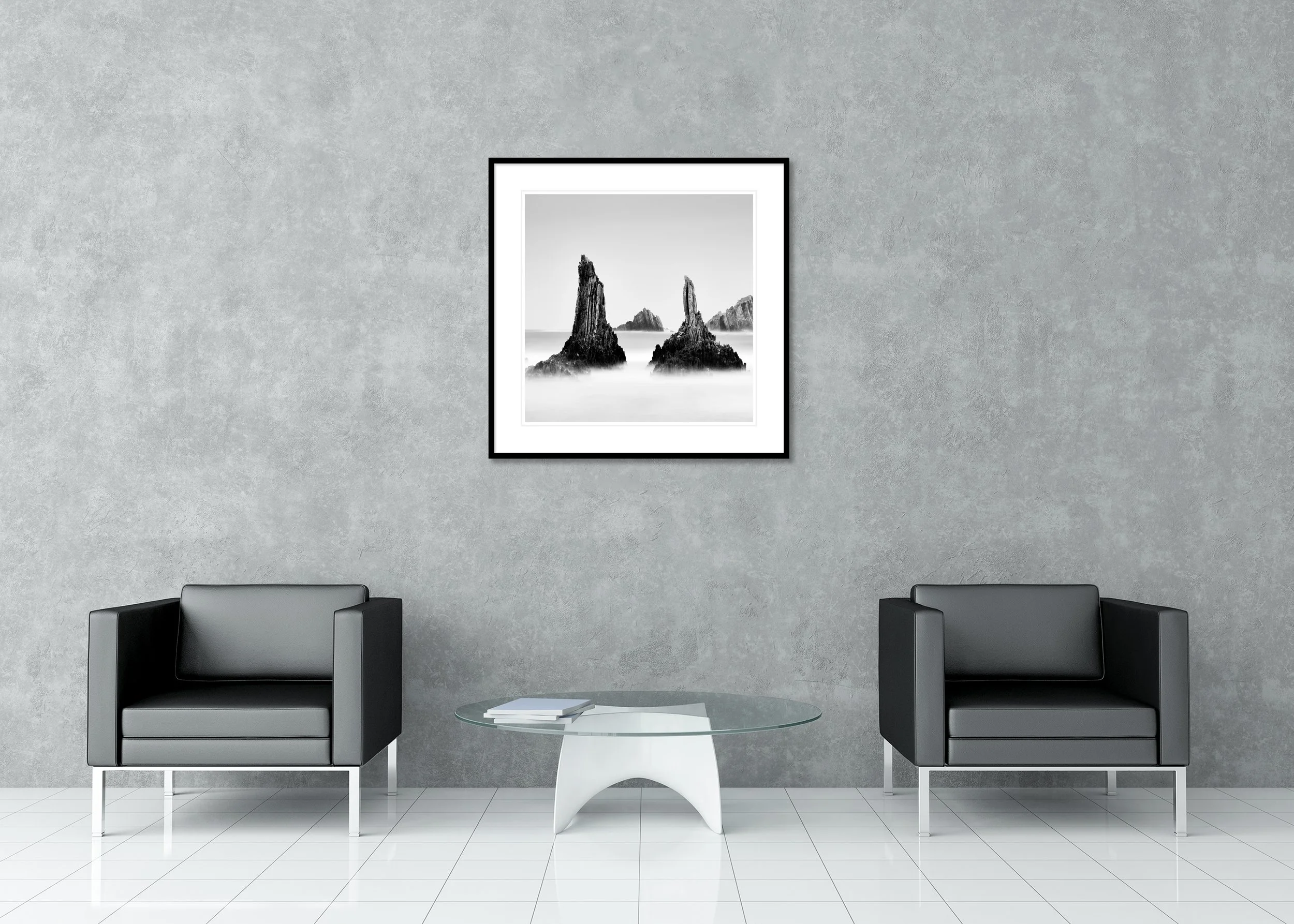 Fine art black-and-white coastal detail of rocky peaks along the Spanish coastline, a minimalist seascape as an archival pigment print in a classic frame with a mount.