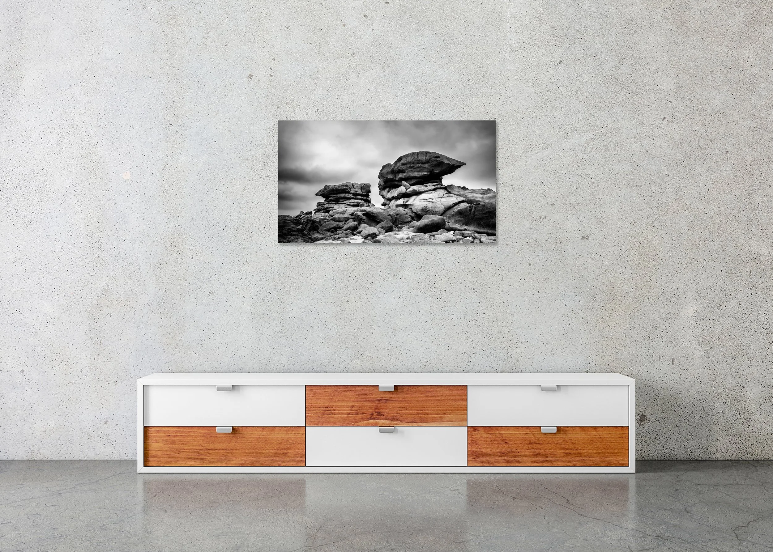 Pink Granite Coast Panorama Study 1 displayed in a modern interior as a frameless black-and-white artwork mounted on aluminium Dibond by Gerald Berghammer.