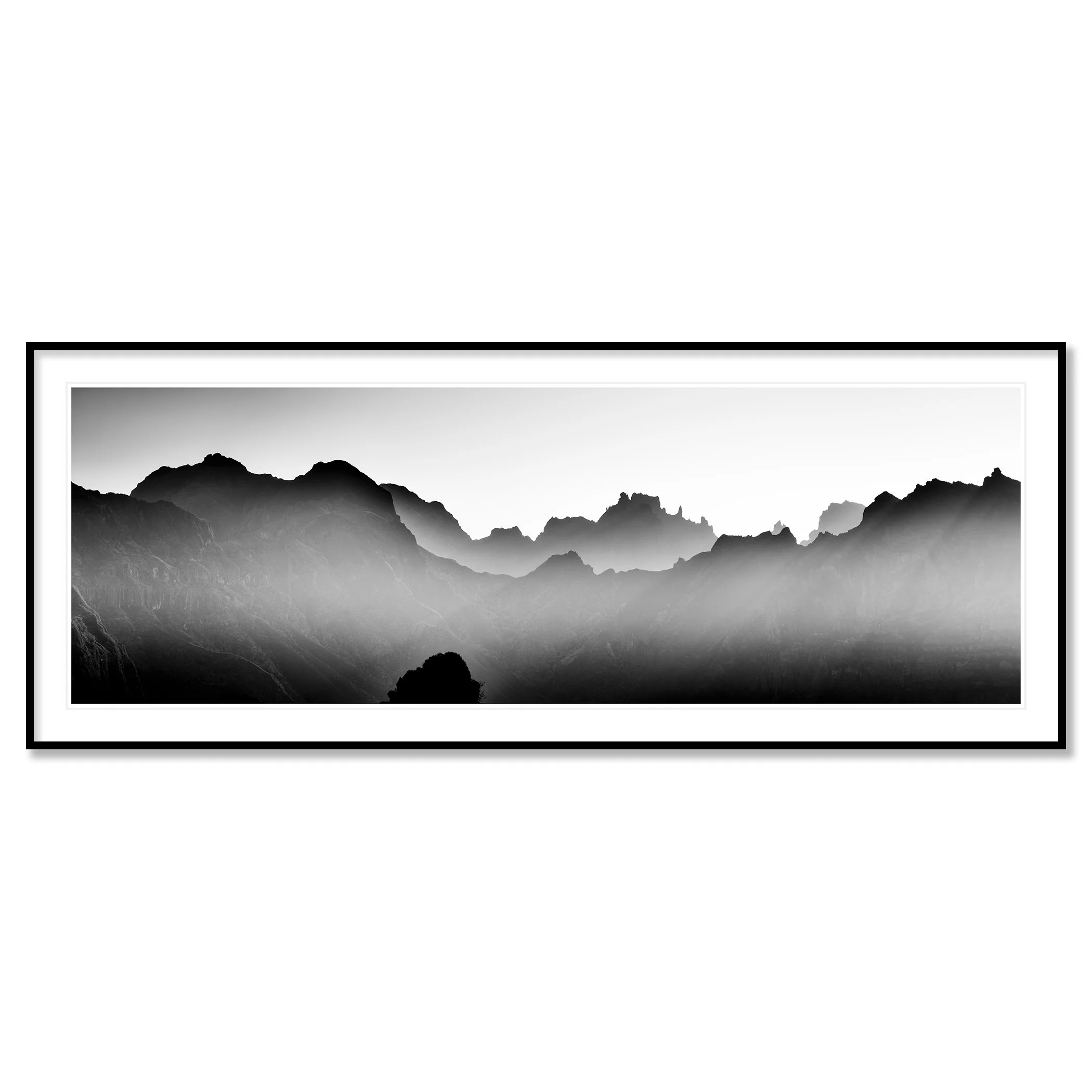 Mountains in Shadow with Morning Light by Gerald Berghammer in a black aluminium frame with a white mount.