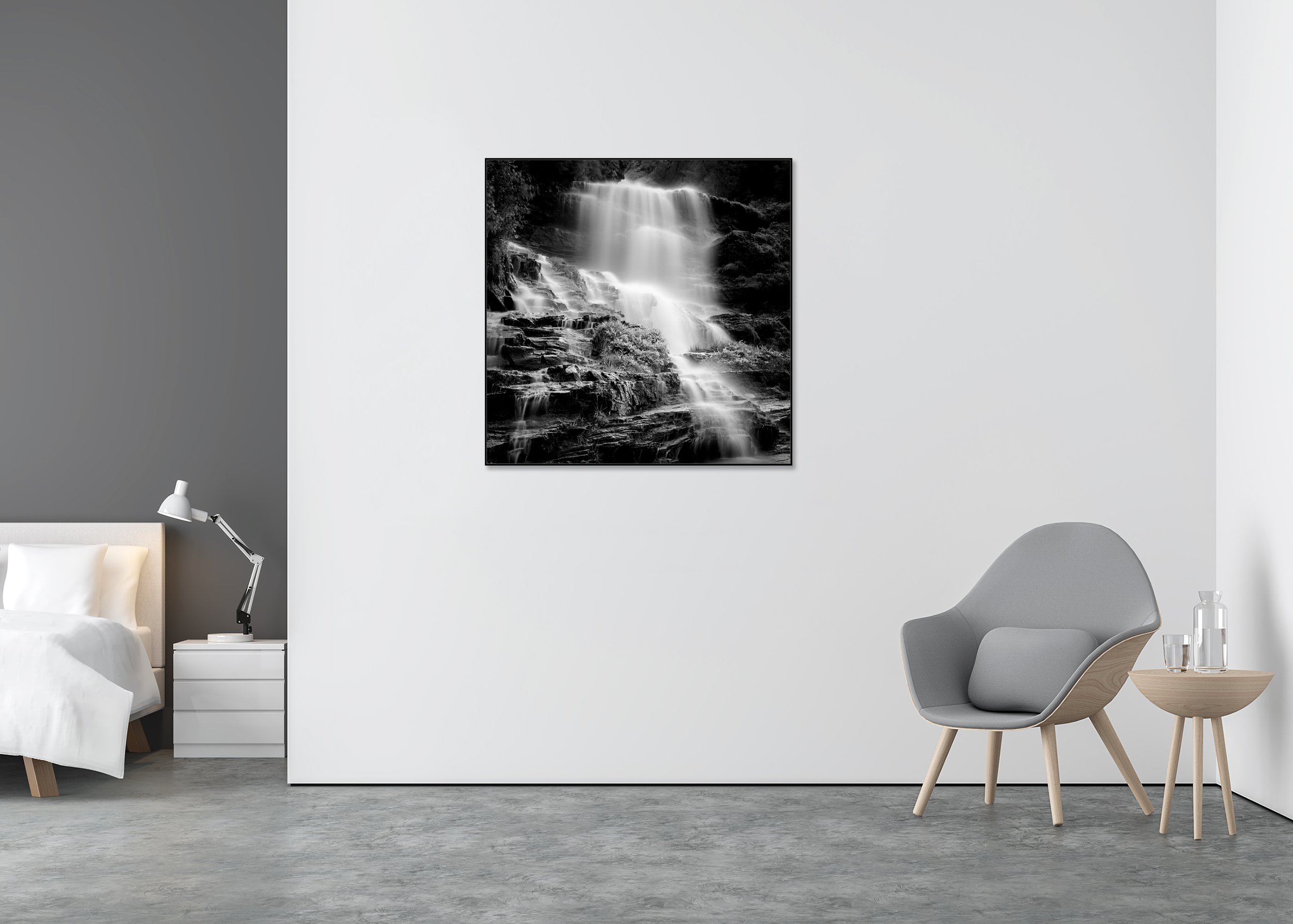Black-and-white cascading waterfall photo print, long-exposure misty water over dark rocks, mounted to Dibond in an aluminium ArtBox frame.