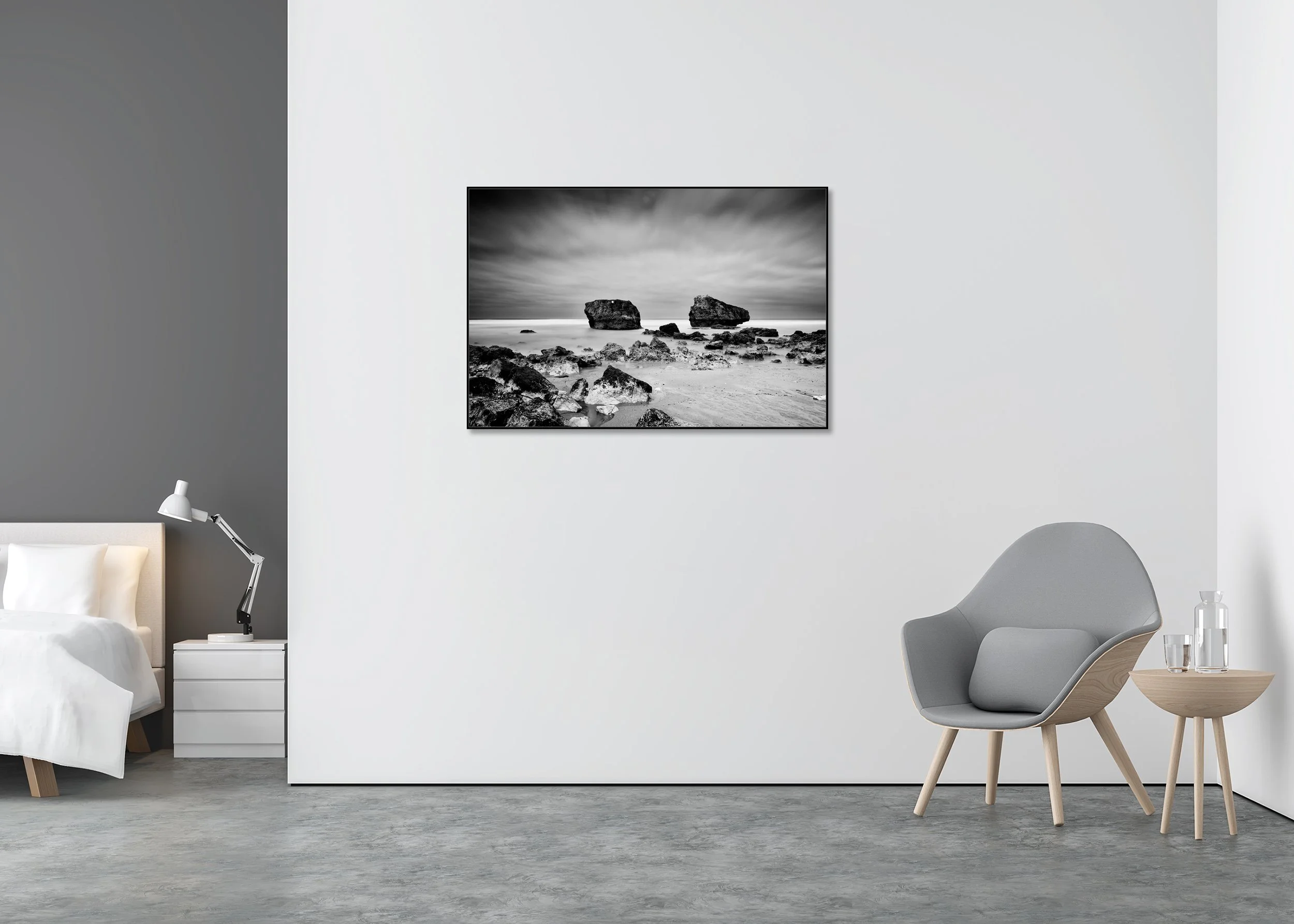 Black and white beach photo print with two rocks in the ocean under a cloudy sky, mounted on Dibond in an aluminium ArtBox.