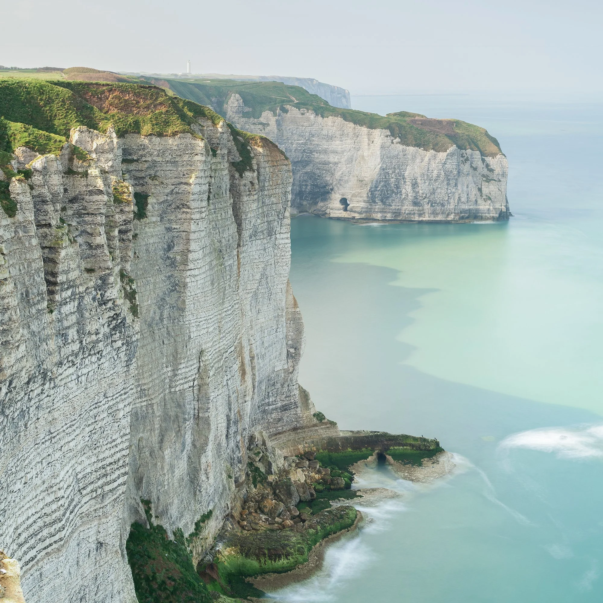 Zoomed-in detail of White Cliffs of Étretat Study 2 showing textured limestone cliffs and long-exposure water.