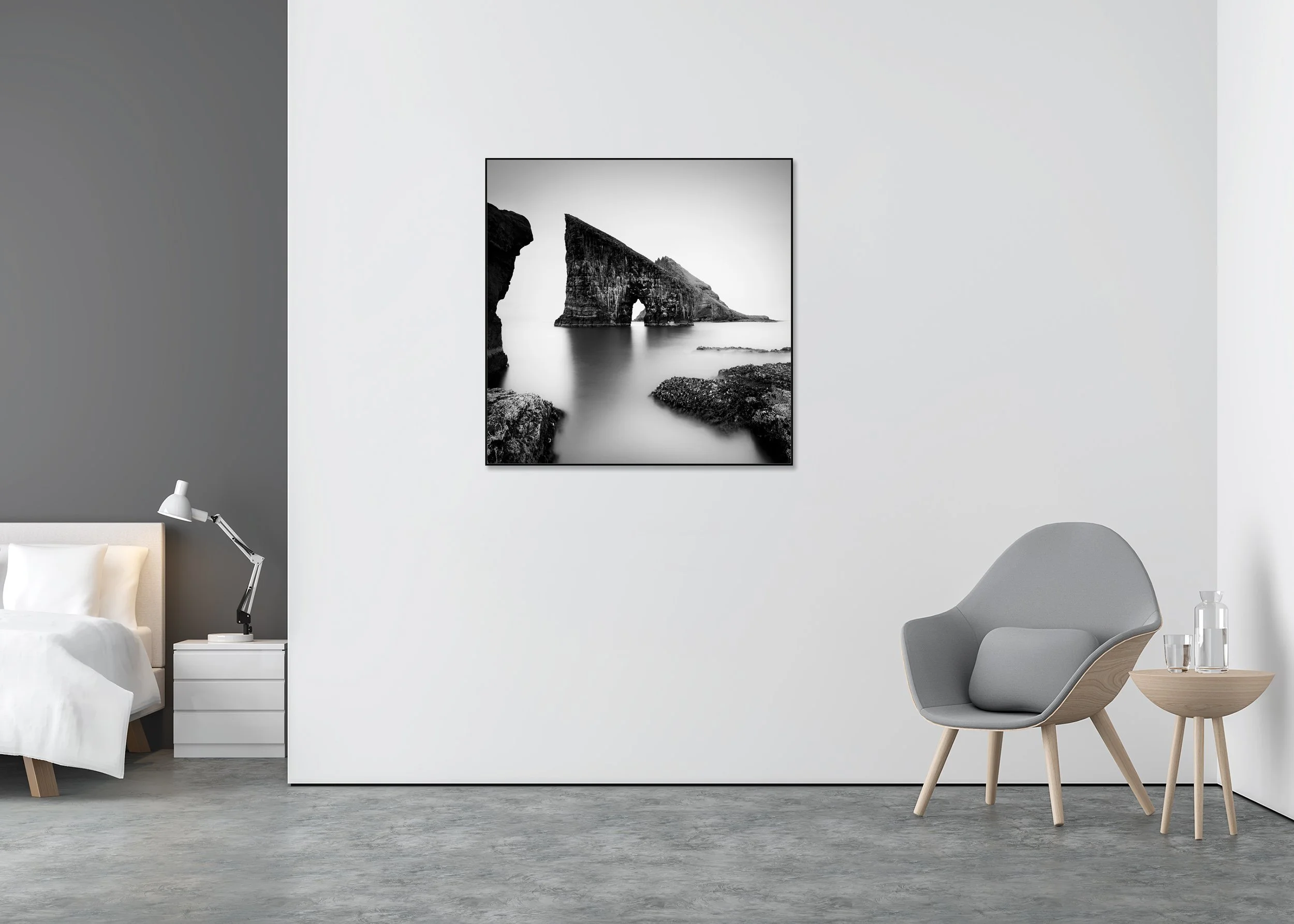 Black and white long-exposure sea arch photo print mounted to Dibond in an aluminium ArtBox, rising from calm coastal water.