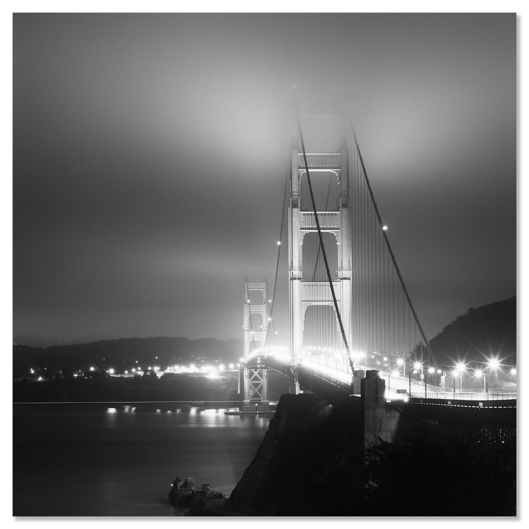 Moody black and white view of the Golden Gate Bridge illuminated at night in San Francisco – dibond frameless