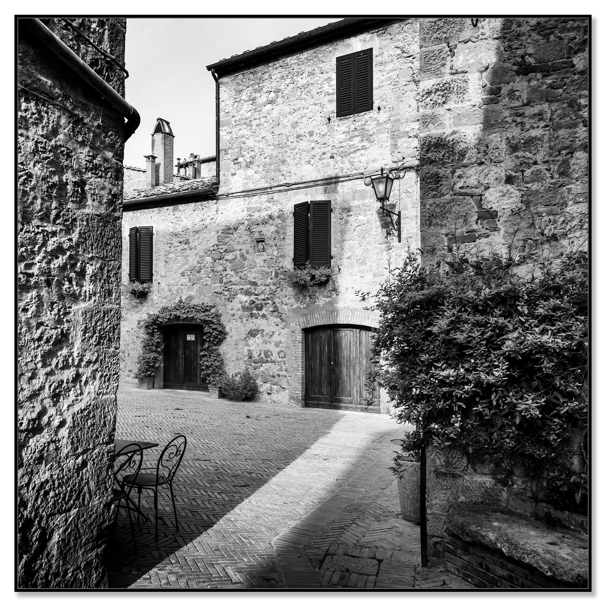 Tuscan Courtyard, Study 1 – black-and-white photograph in a black aluminium ArtBox frame.