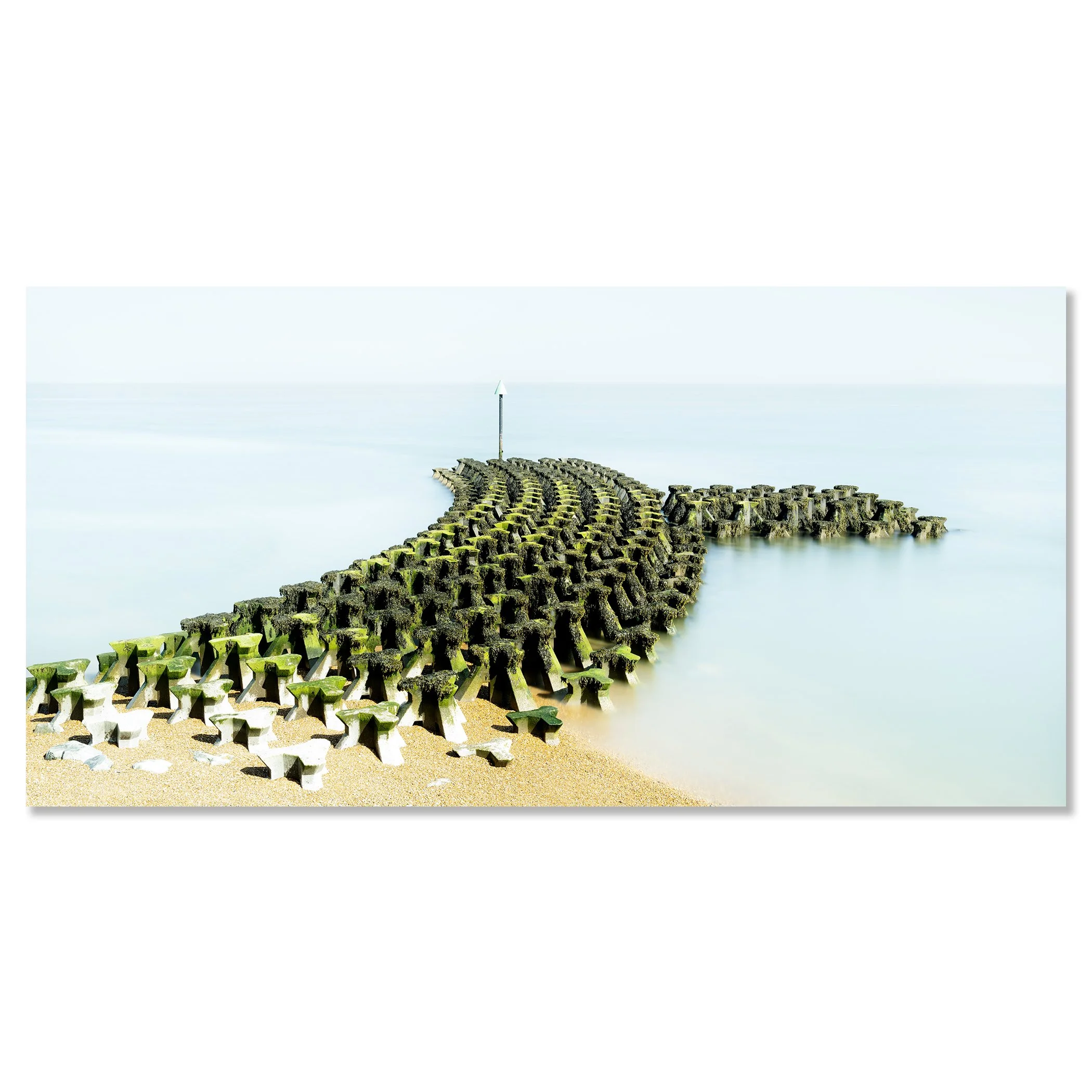 Gerald Berghammer - Color seascape panorama photography. Concrete breakwater structures on a beach extending into the water, with a pole at the end. Chromaluxe frameless