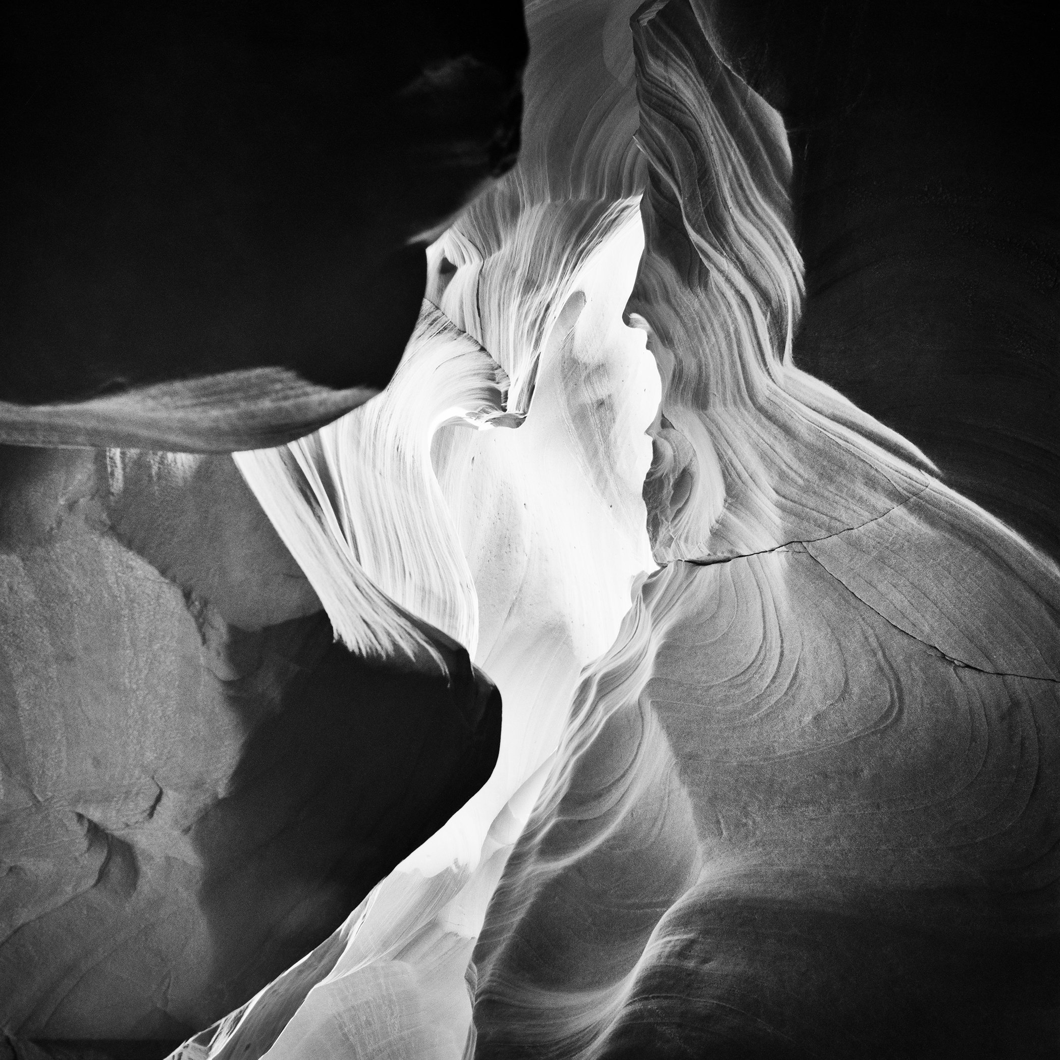 Antelope Canyon Study 9 by Gerald Berghammer, black-and-white fine art photograph of sculptural sandstone formations in Arizona, USA.