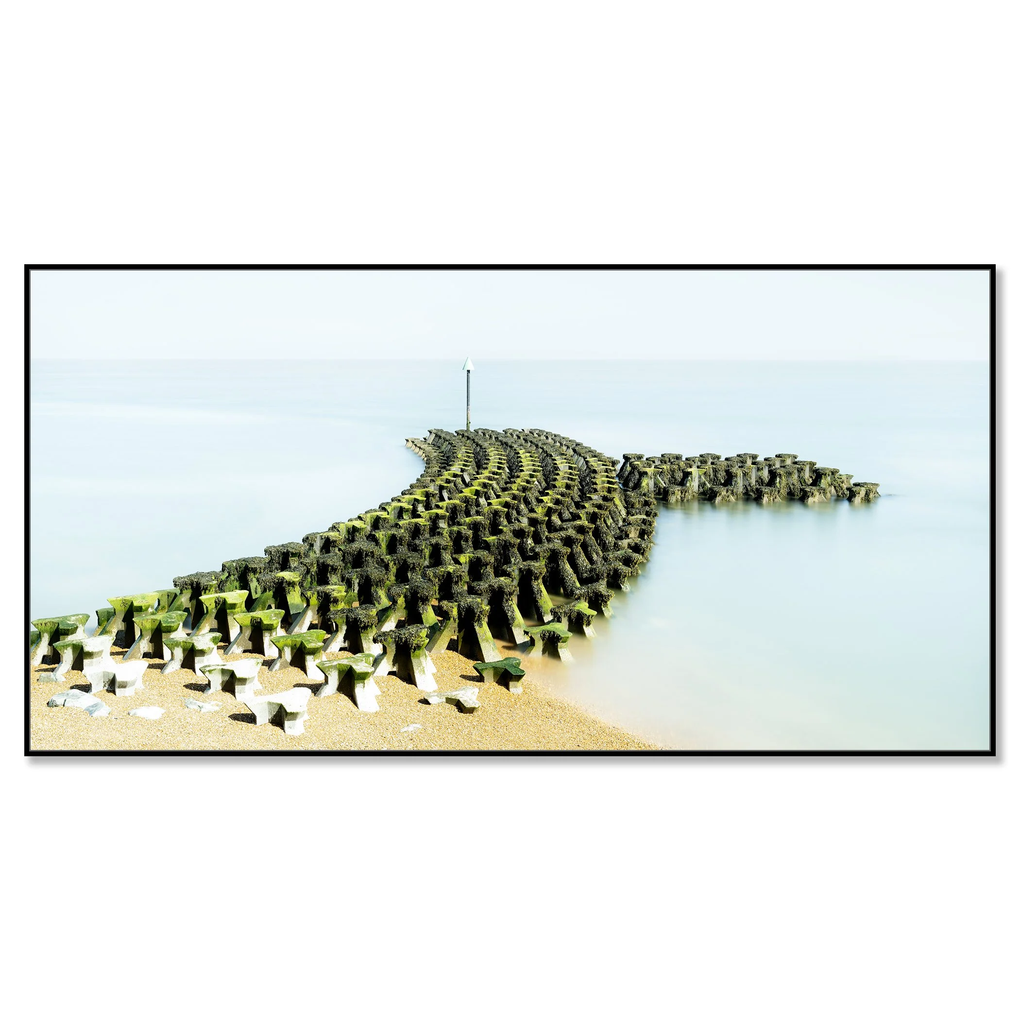 Gerald Berghammer - Color seascape panorama photography. Concrete breakwater structures on a beach extending into the water, with a pole at the end. Chromaluxe framed black