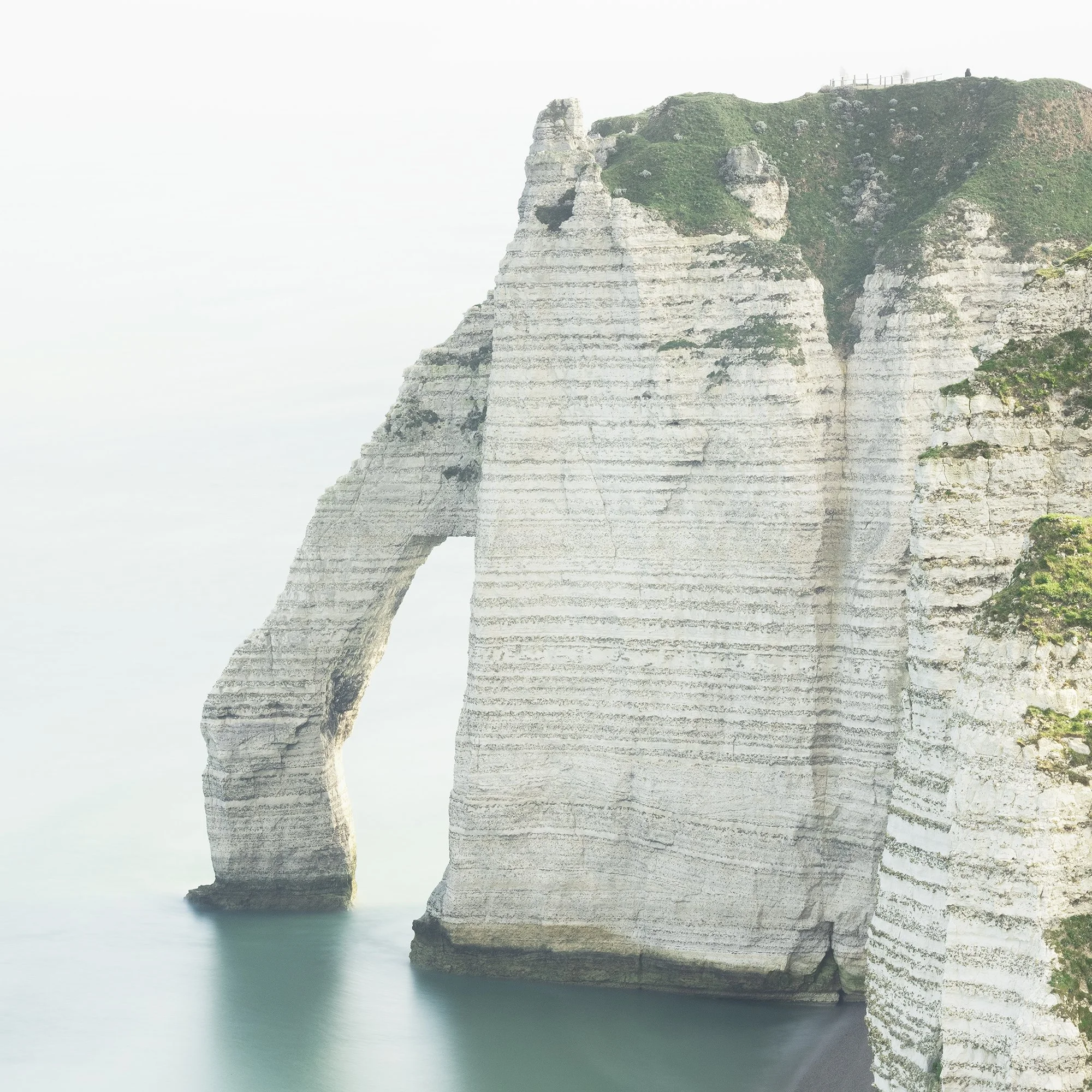 Detail of Étretat’s chalk arch and cliff face in Gerald Berghammer’s coastal photograph