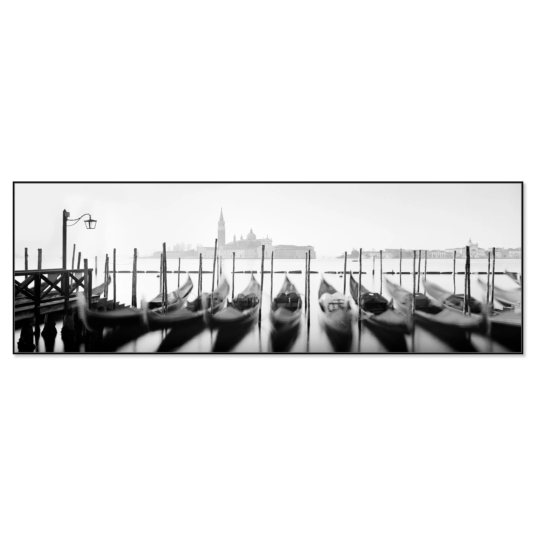 Black-and-white photo of gondolas moored on a Venice canal with historic buildings and a clock tower – framed ArtBox black