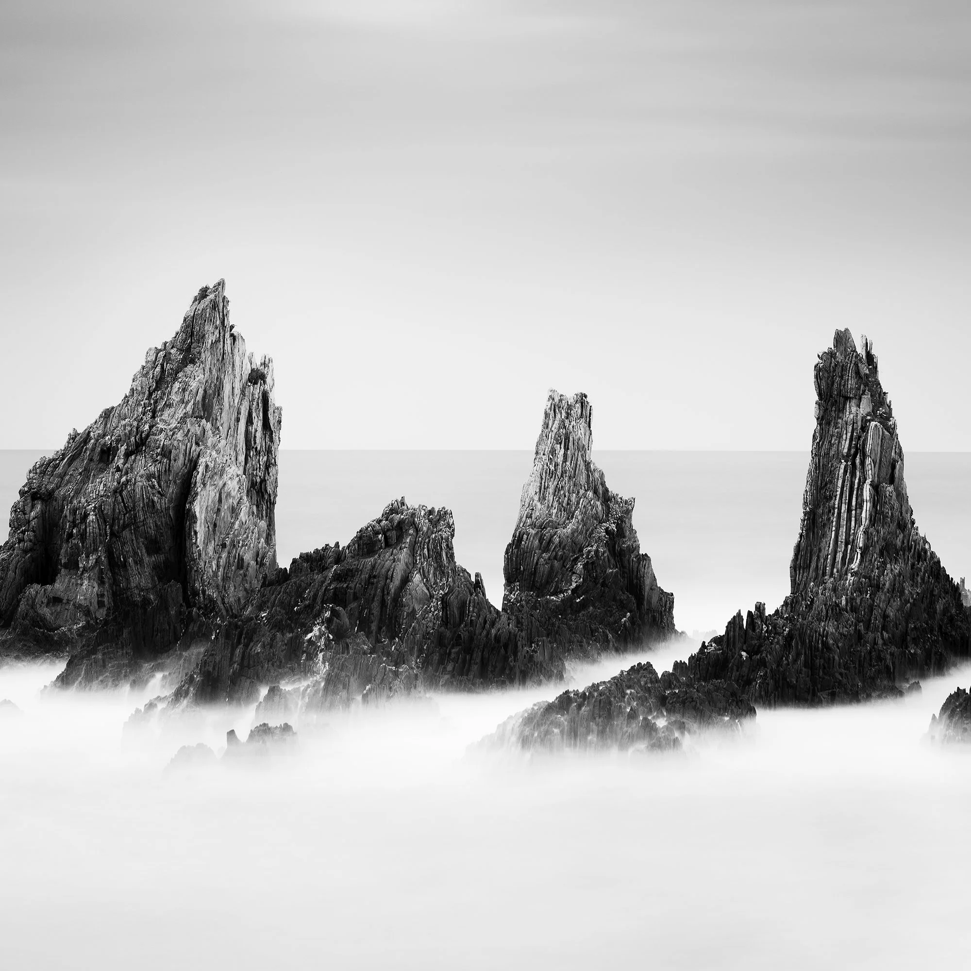 Close-up detail of Rocky Peaks Study 4 – Spain showing rugged coastal rocks and soft long-exposure water