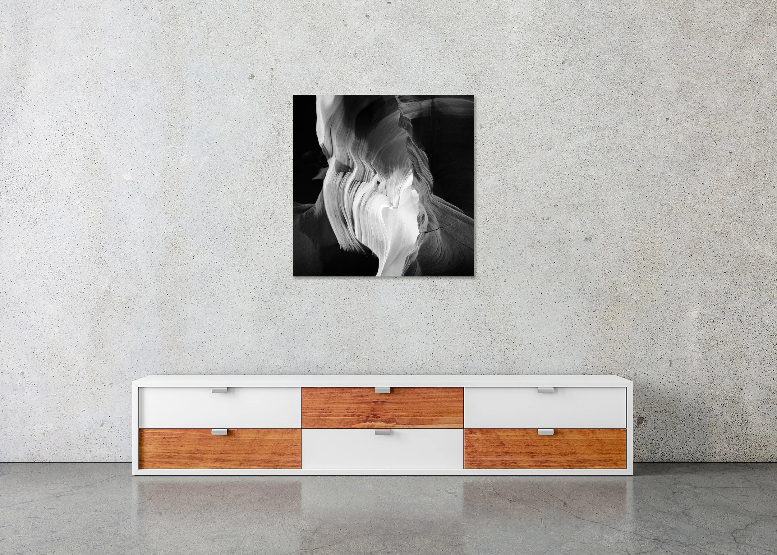 Black and white photograph of Antelope Canyon with smooth flowing sandstone walls shaped by erosion and light, photo print mounted to Dibond, frameless.