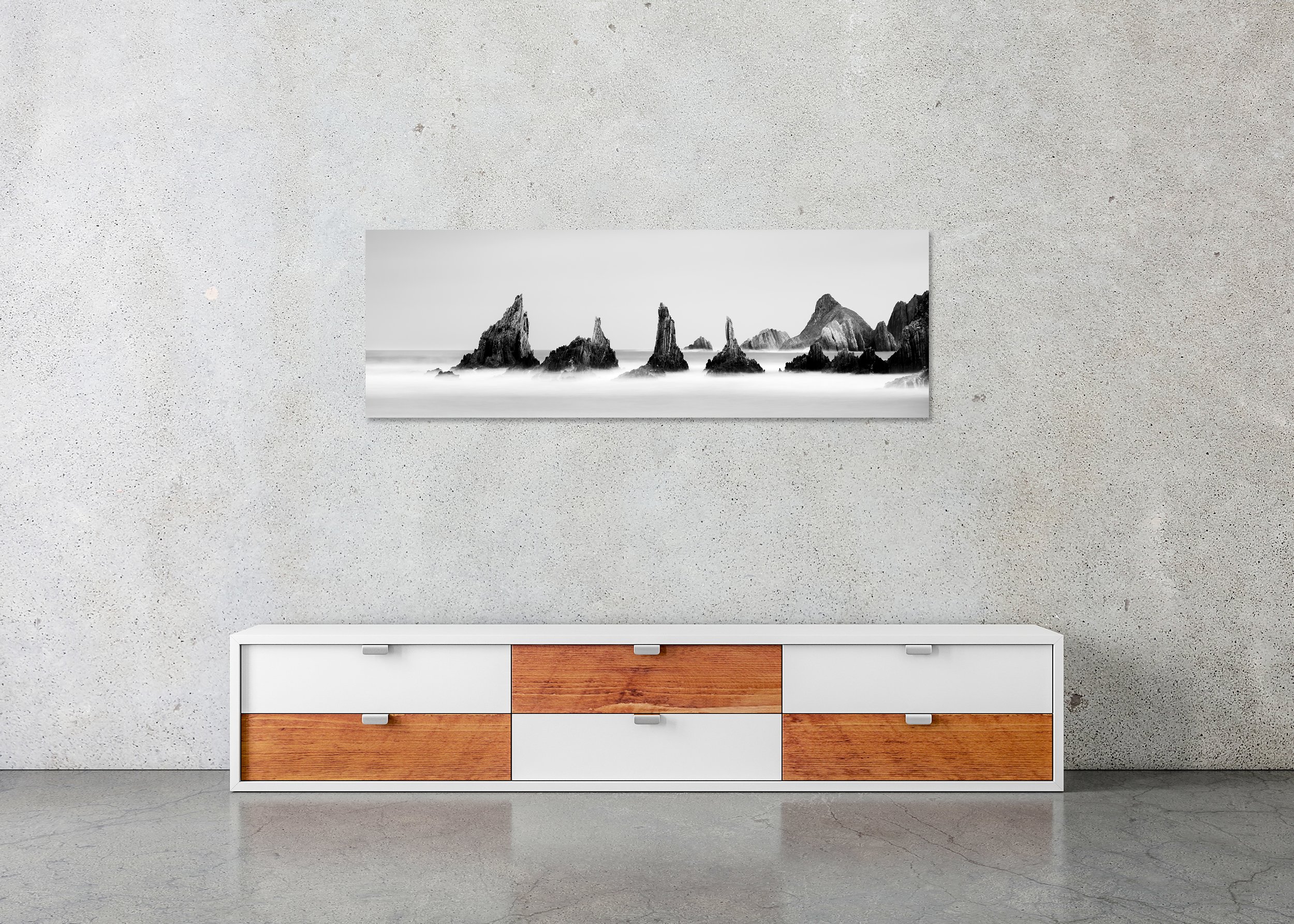 Black and white long-exposure seascape print with jagged sea stacks rising from a misty ocean, photo print mounted to Dibond, frameless.