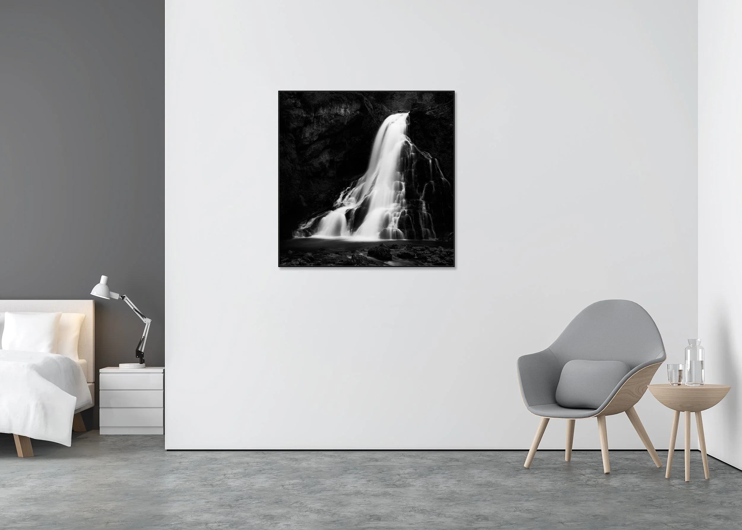 Black-and-white long-exposure waterfall cascading over dark rocks into a calm pool as a ChromaLuxe metal print in an Aluminium ArtBox