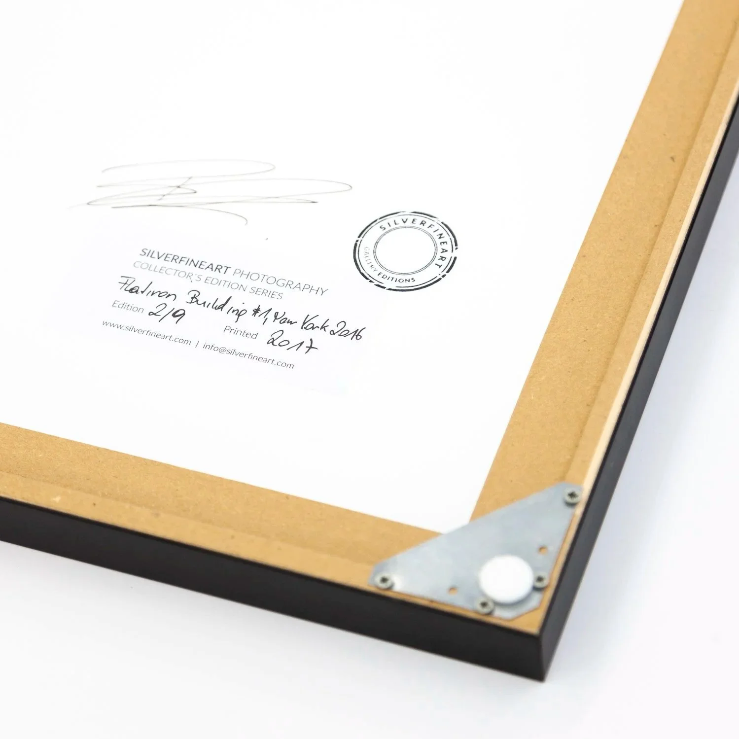 Reverse of Flatiron Building 1 showing the signed edition label, gallery stamp and wooden frame by Gerald Berghammer.