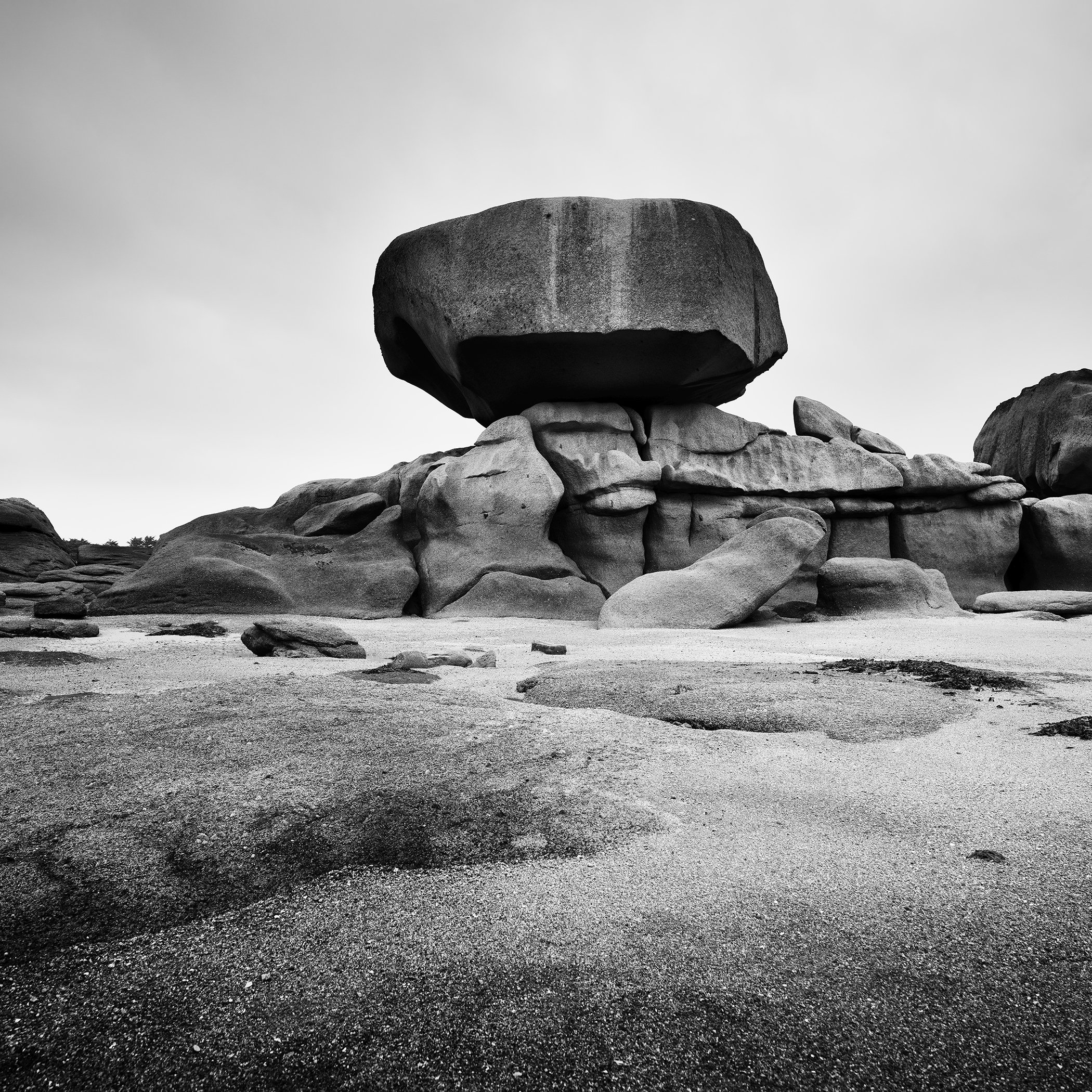 Pink Granite Coast Study 1 by Gerald Berghammer, black-and-white fine art photograph of monumental granite rock formations in Brittany, France.