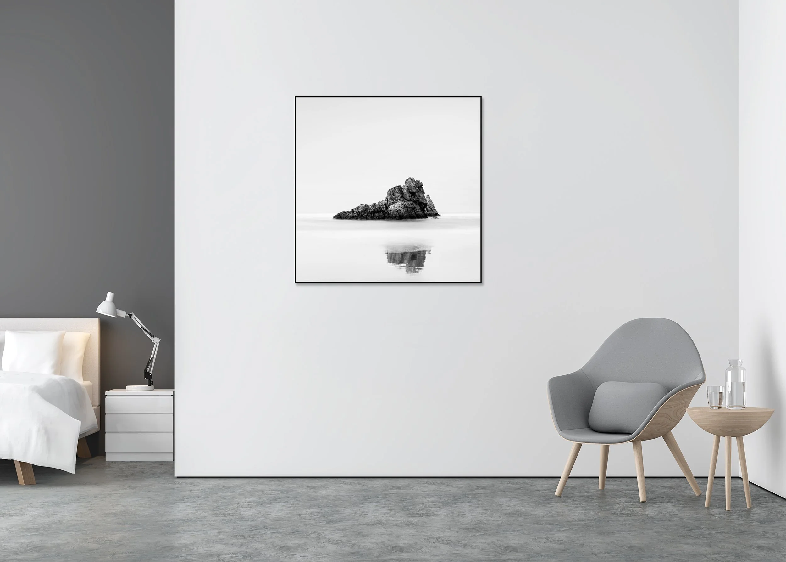 Rock on the Beach, Study 1 – black-and-white Dibond print in a black aluminium ArtBox in a minimalist bedroom