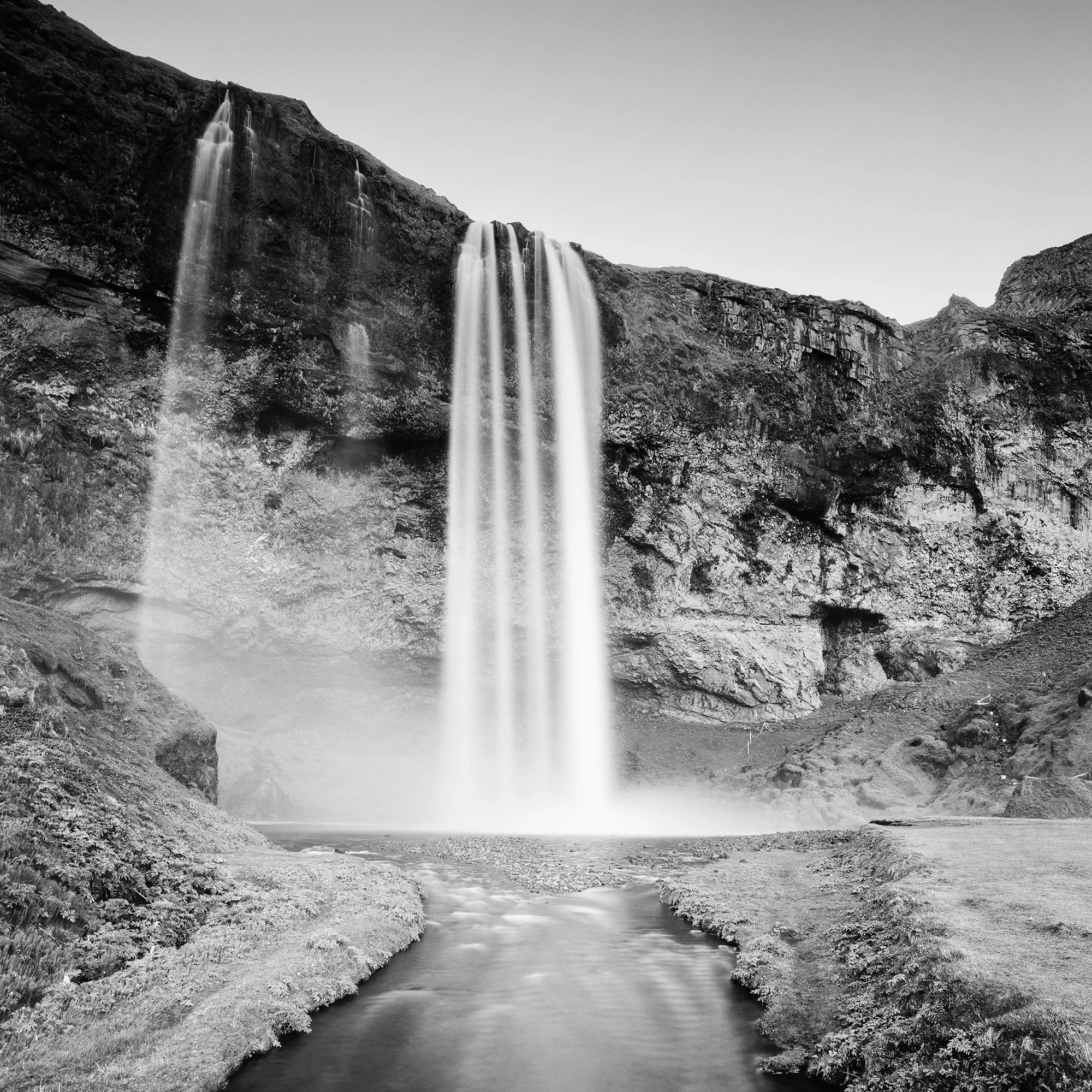 Detail of Seljalandsfoss Study 1 by Gerald Berghammer, showing the waterfall and surrounding Icelandic landscape in black and white.