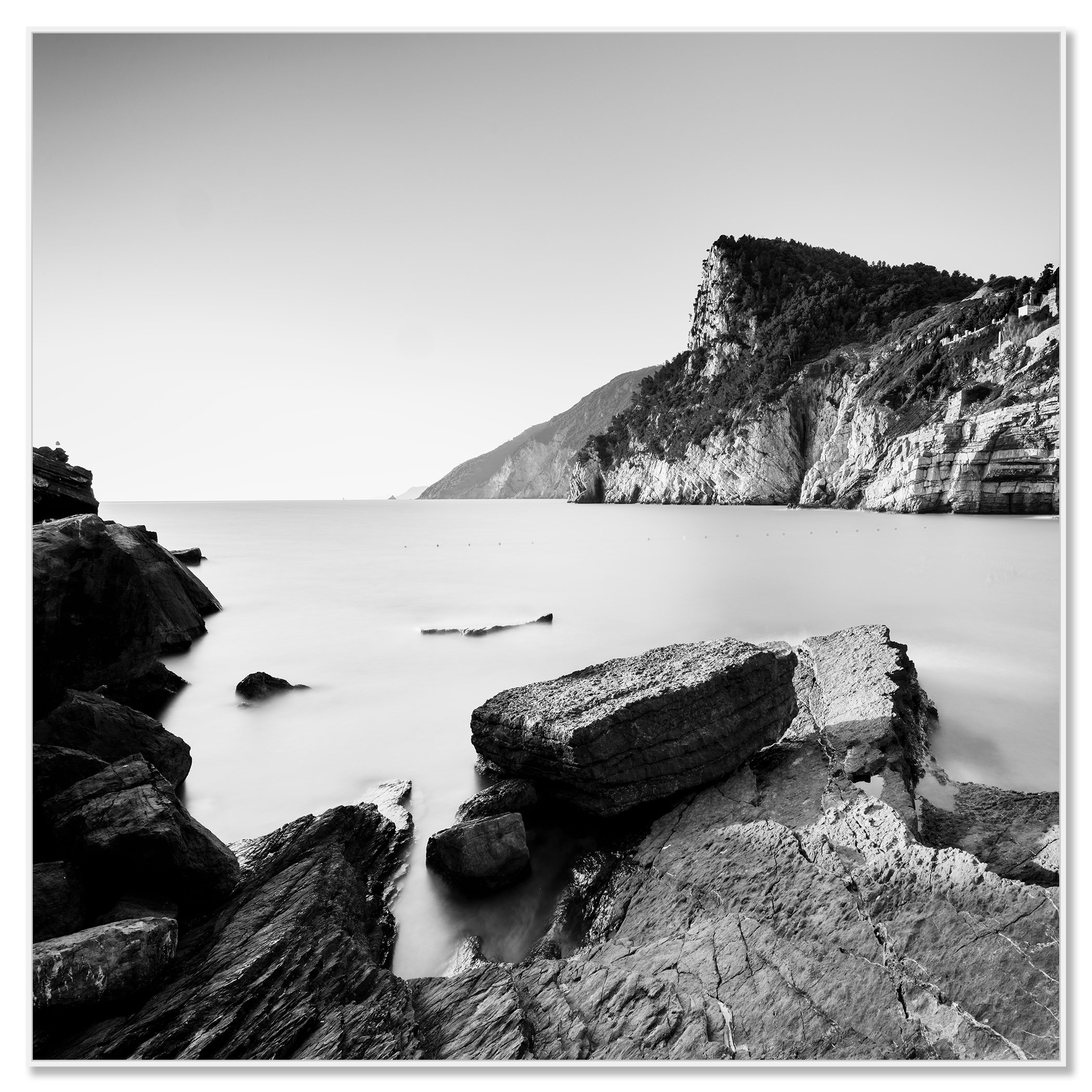 The Rocky Coast of Porto Venere – black-and-white photograph presented in a white aluminium ArtBox frame.