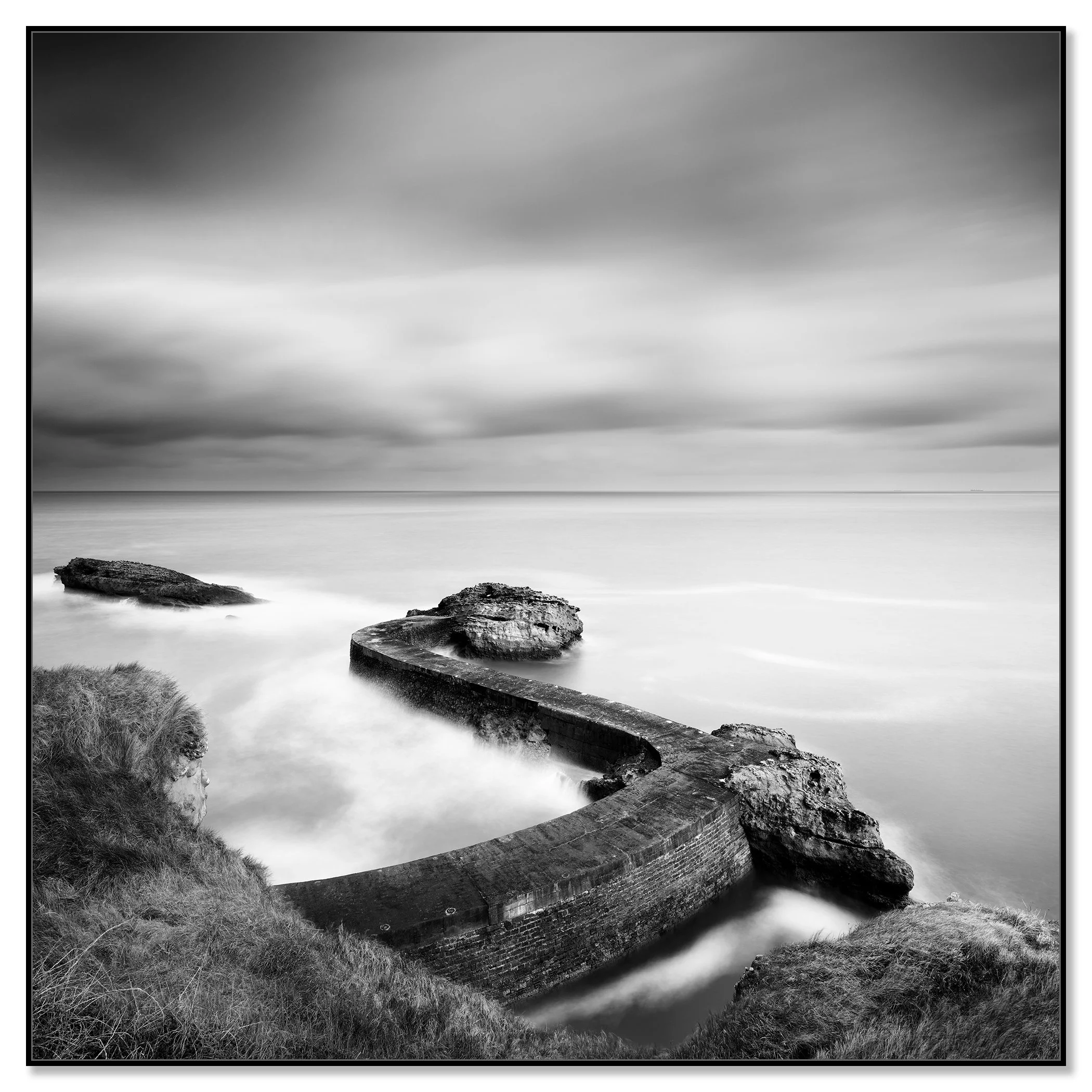 Breakwater Pier Study 1 by Gerald Berghammer, black-and-white Dibond fine art print in a black aluminium ArtBox frame.