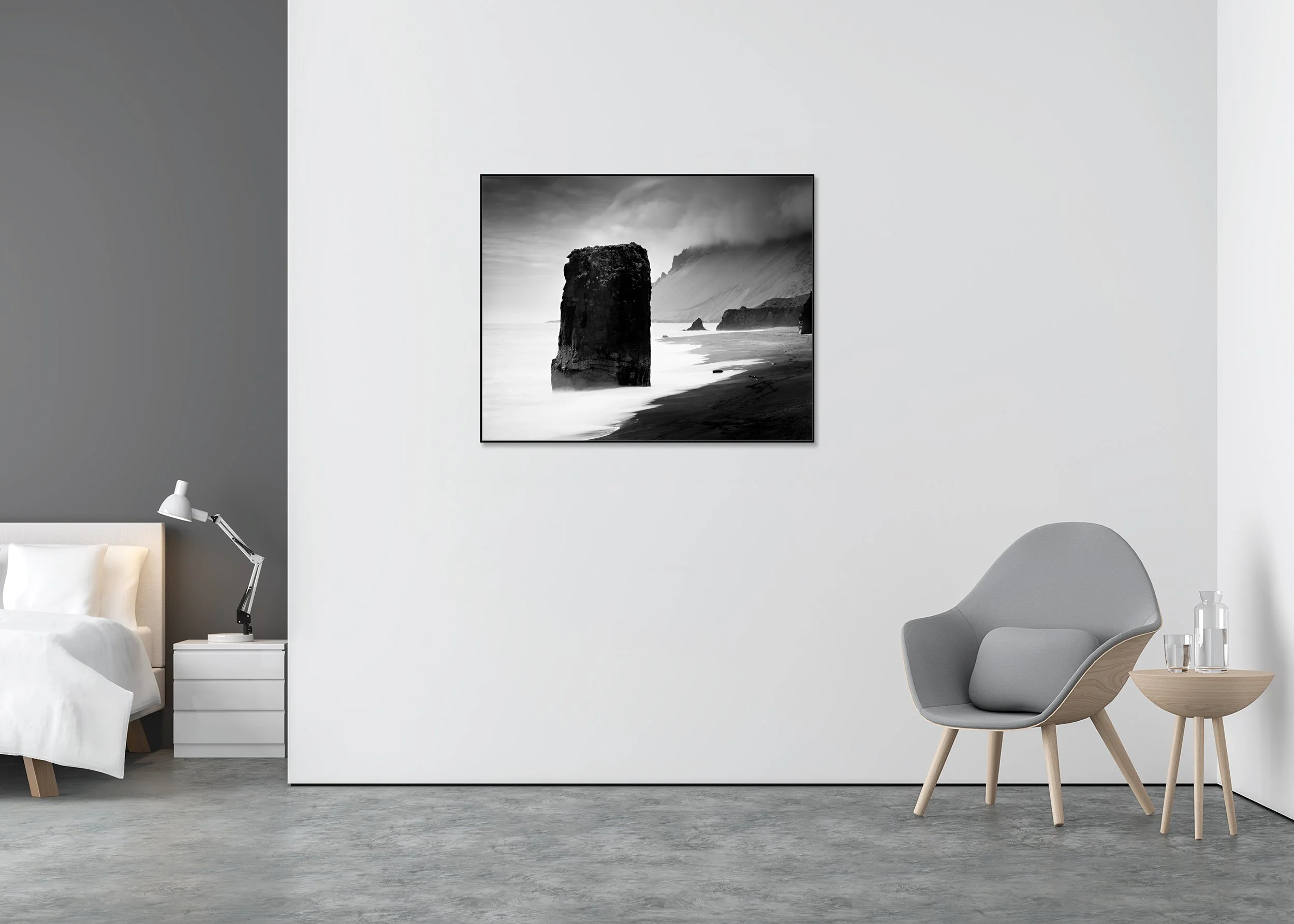 Flooded Rock – Black Beach, Iceland, black-and-white photograph on Dibond in an aluminium ArtBox displayed in a minimalist interior. Photo by Gerald Berghammer.