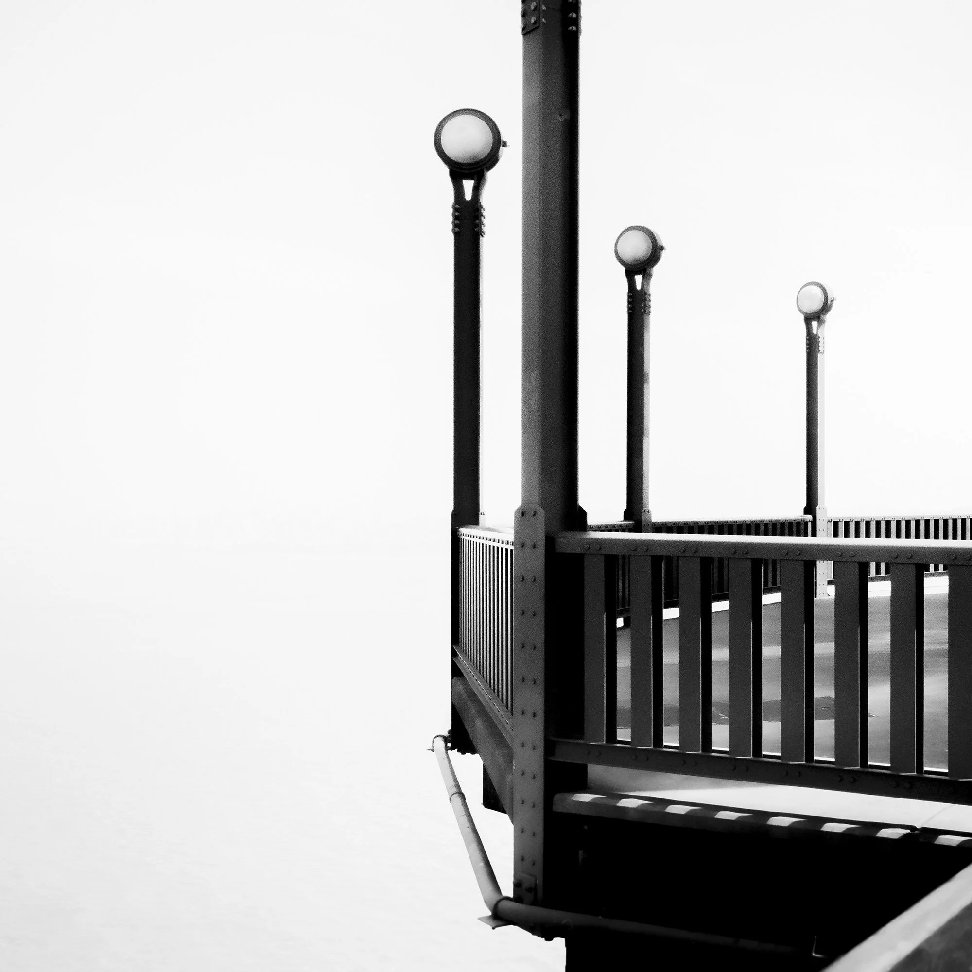 Detail of Golden Gate Study 9 showing bridge lamps, railings and expansive negative space in San Francisco by Gerald Berghammer.