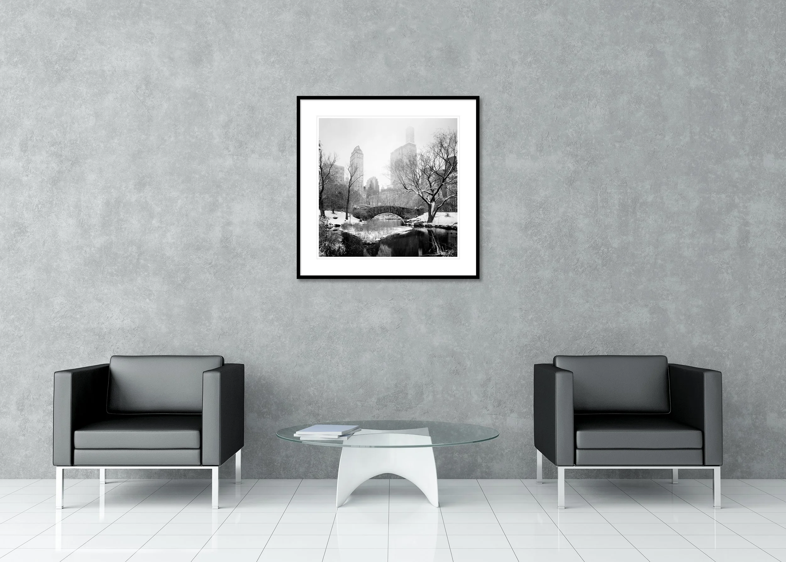 Black and white archival pigment print of a winter stone bridge in Central Park with snow-covered trees, in a classic frame with a mount