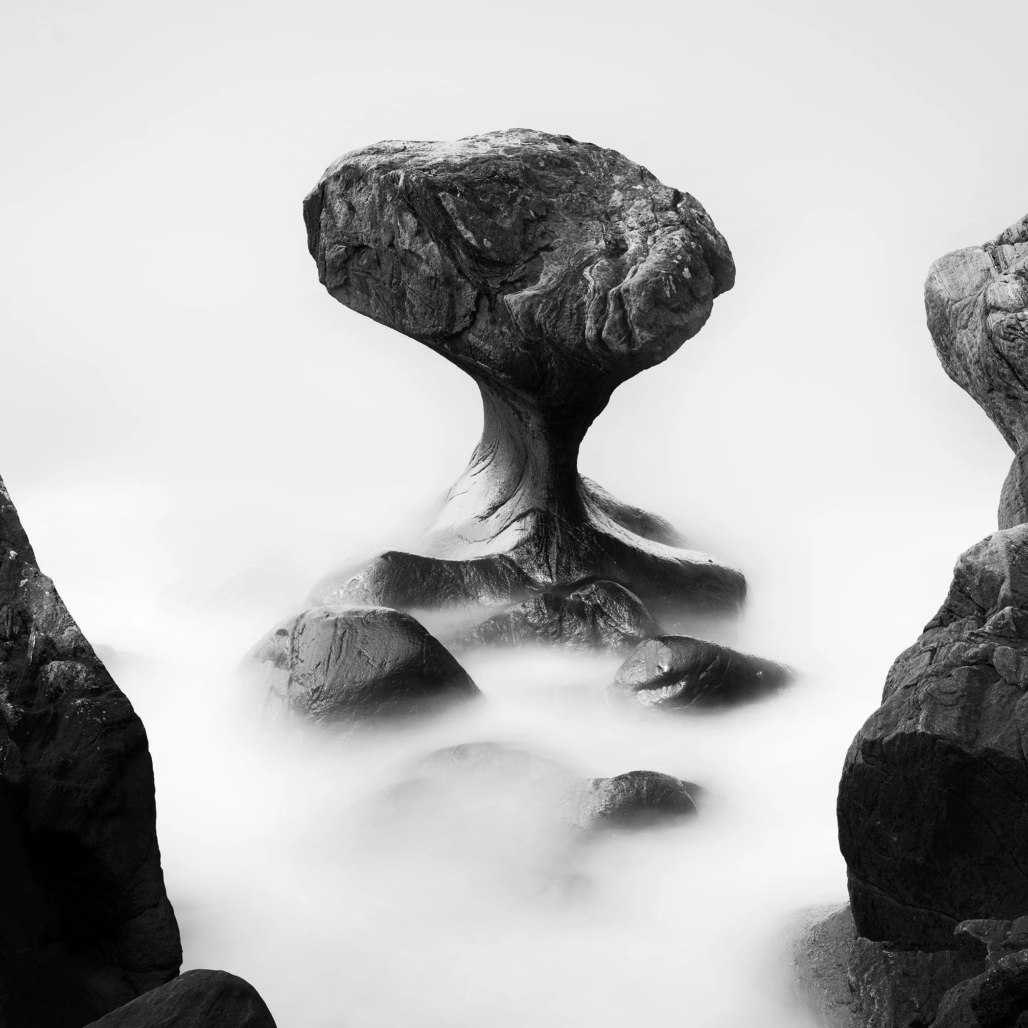 Attracted by the Sea Study 2 by Gerald Berghammer, minimalist black-and-white long-exposure seascape of the Kannesteinen rock formation in Norway.