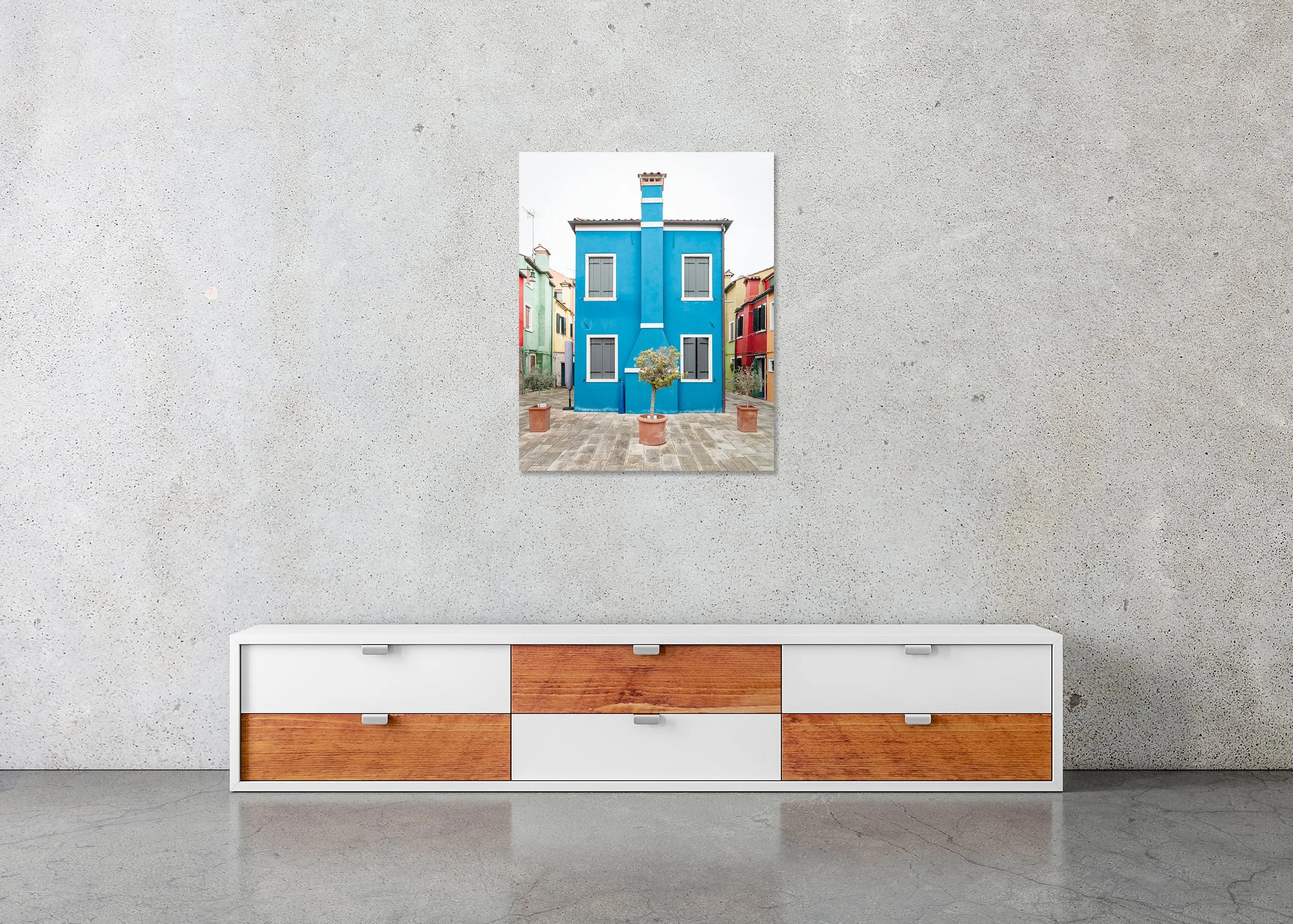 The Blue House displayed in a modern interior as a frameless colour aluminium Dibond print by Gerald Berghammer.